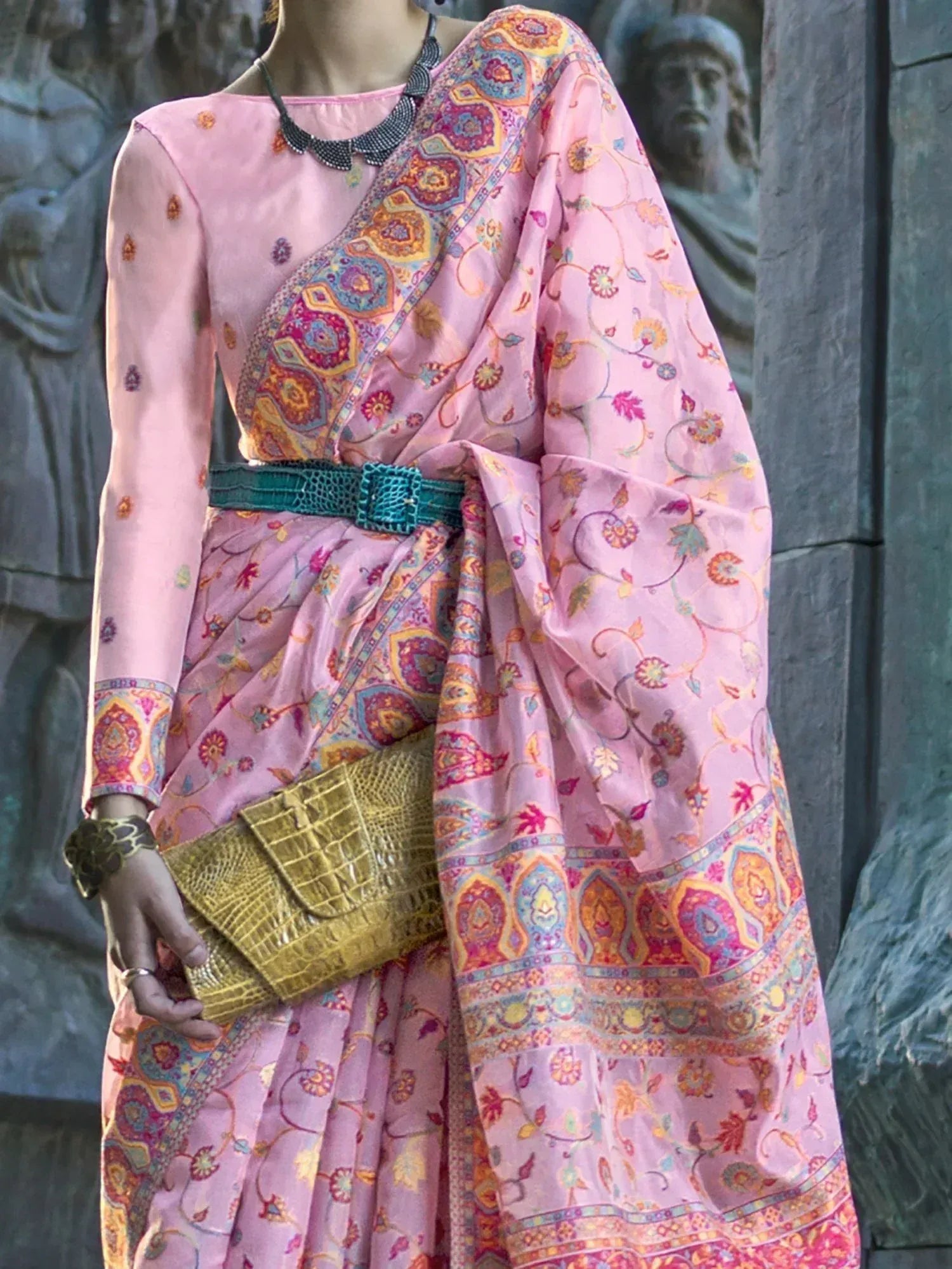 Pink printed ethnic gown with belt and clutch, styled for Indian wear