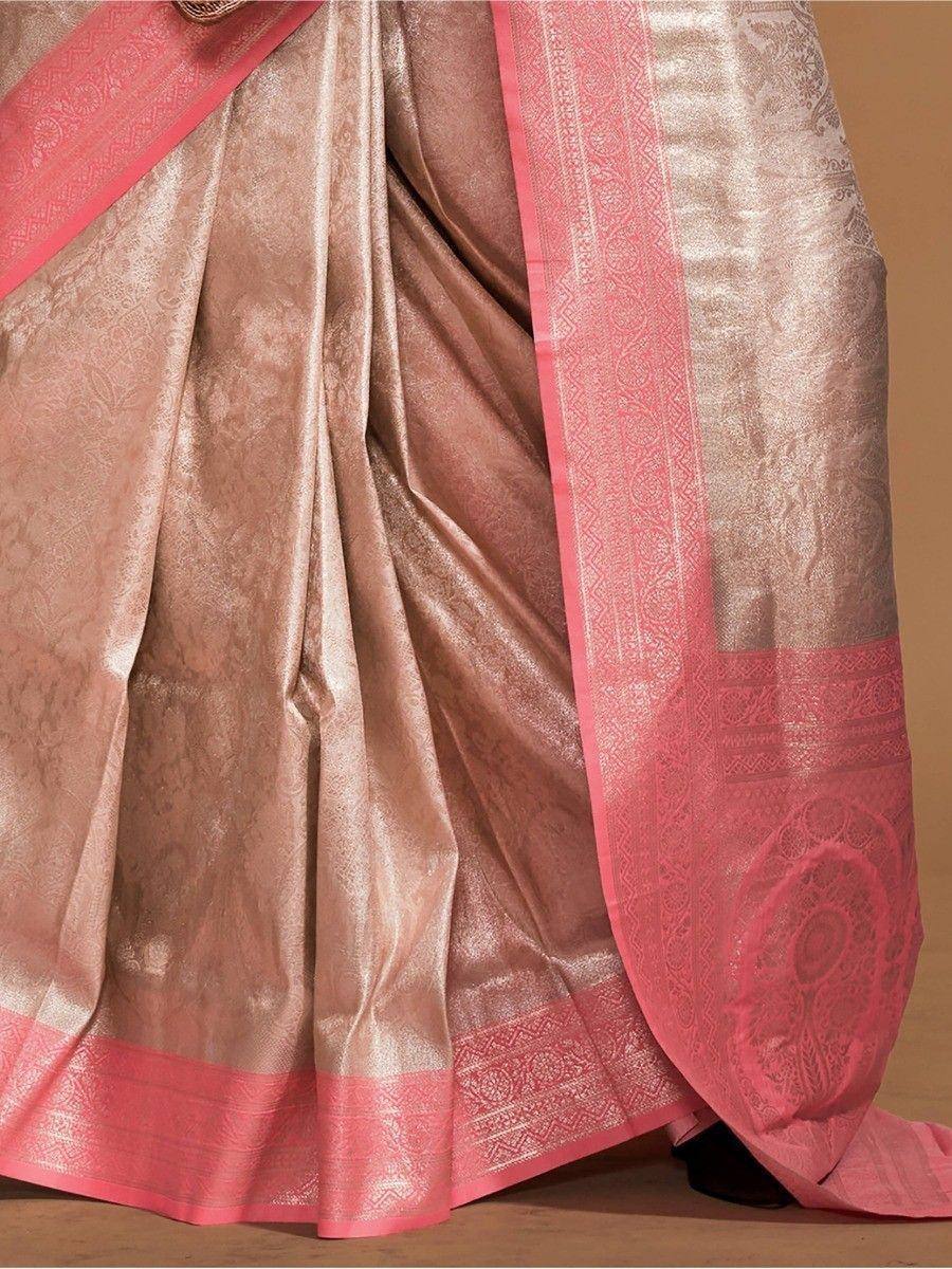 Pink and gold designer saree with intricate border and woven motifs, perfect for ethnic occasions