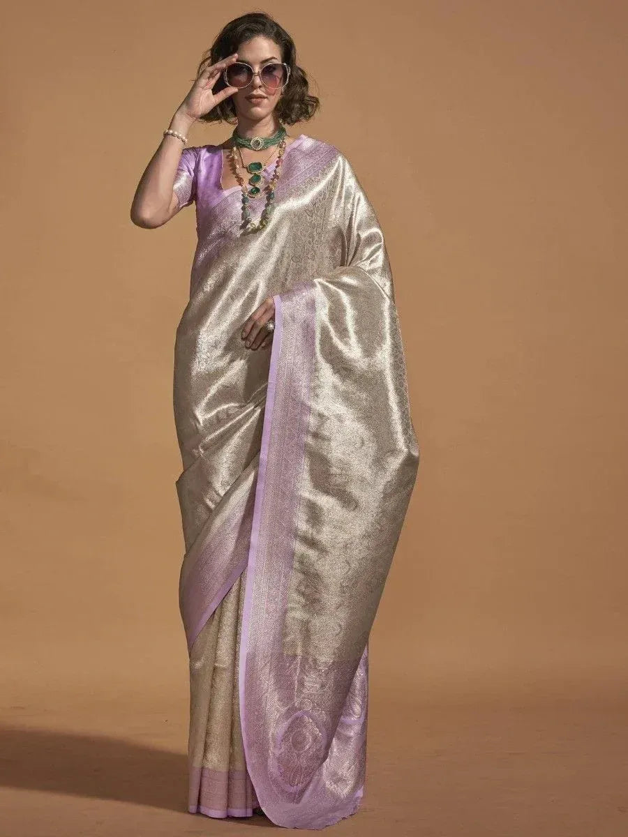 Elegant lavender and gold silk saree with intricate weave, perfect for Indian ethnic occasions
