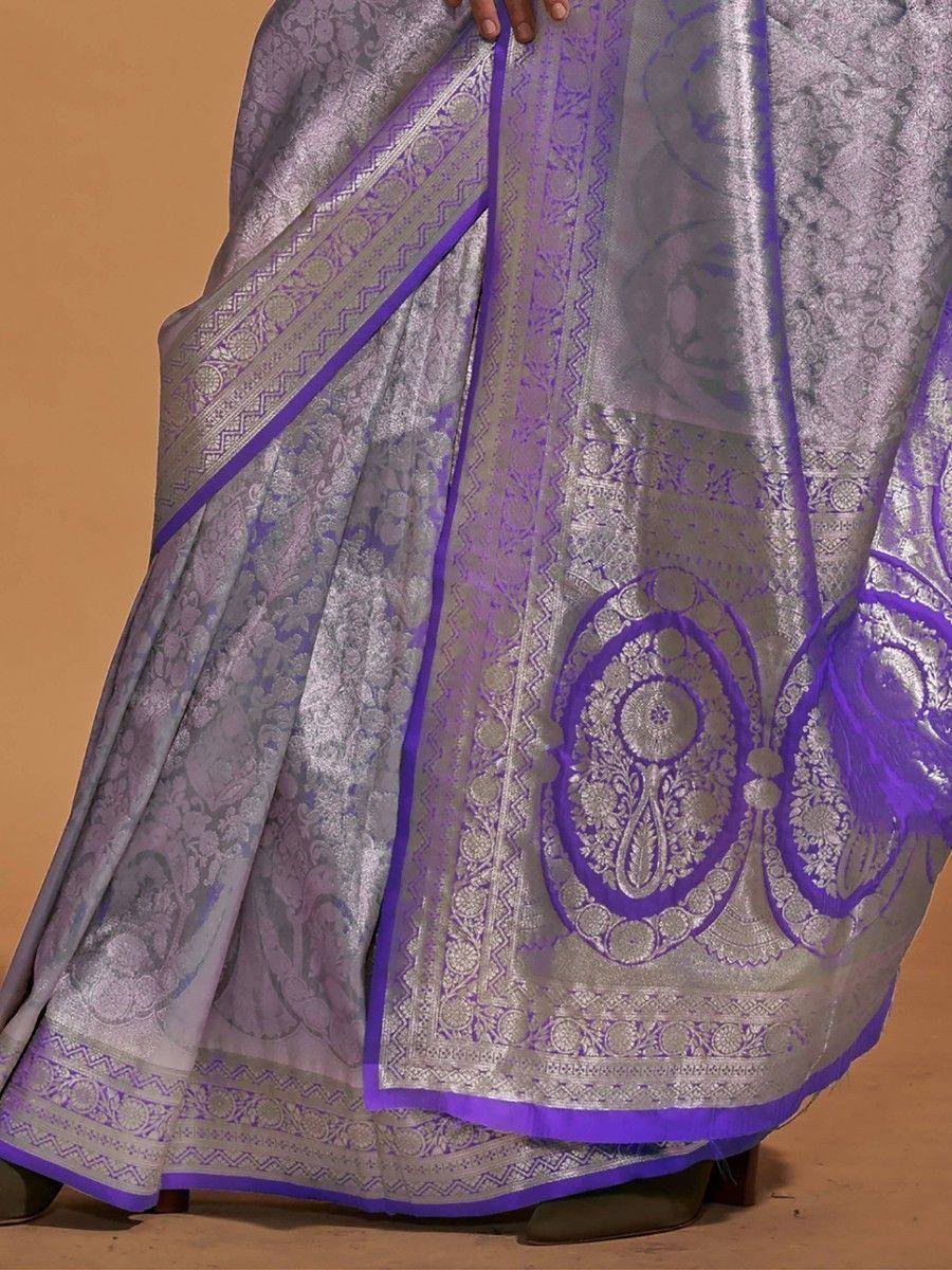 Purple and silver designer saree with intricate paisley and border embroidery, perfect for ethnic occasions.