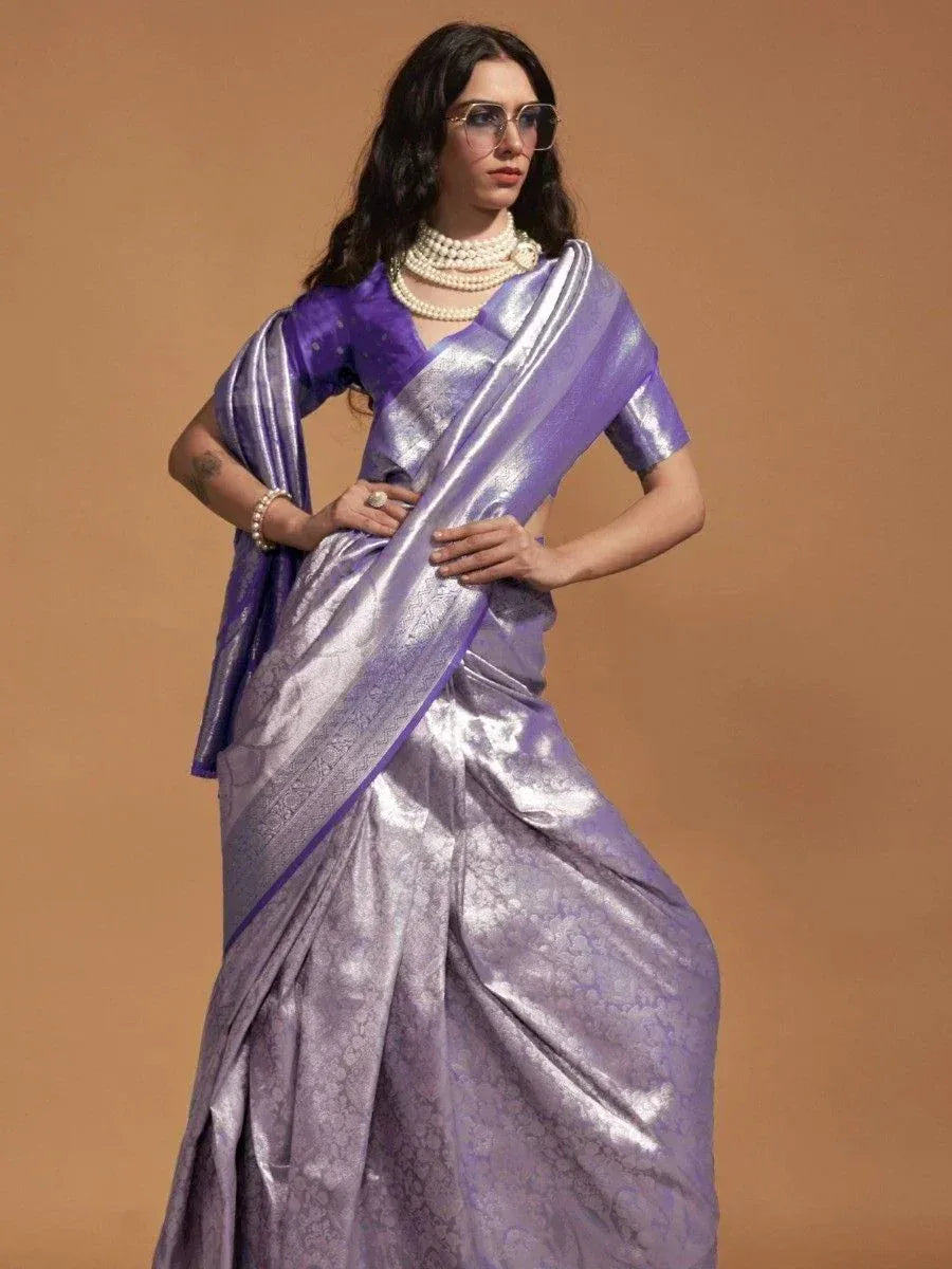 Purple metallic saree with matching blouse, pearl necklace, and sunglasses for ethnic wear