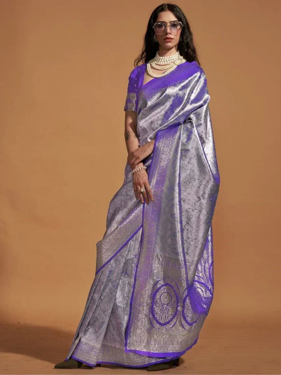 Purple and silver designer saree with intricate woven patterns, perfect for ethnic occasions