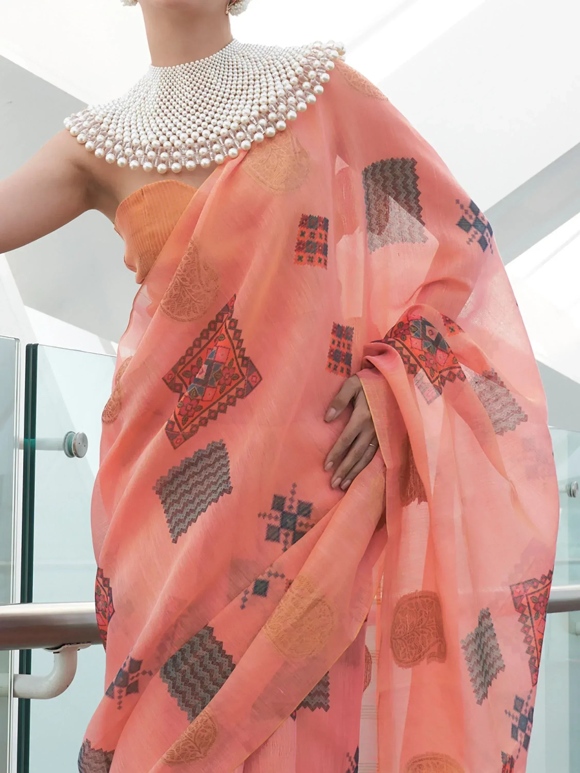 Peach printed saree with pearl embellished neckline, ethnic wear for women