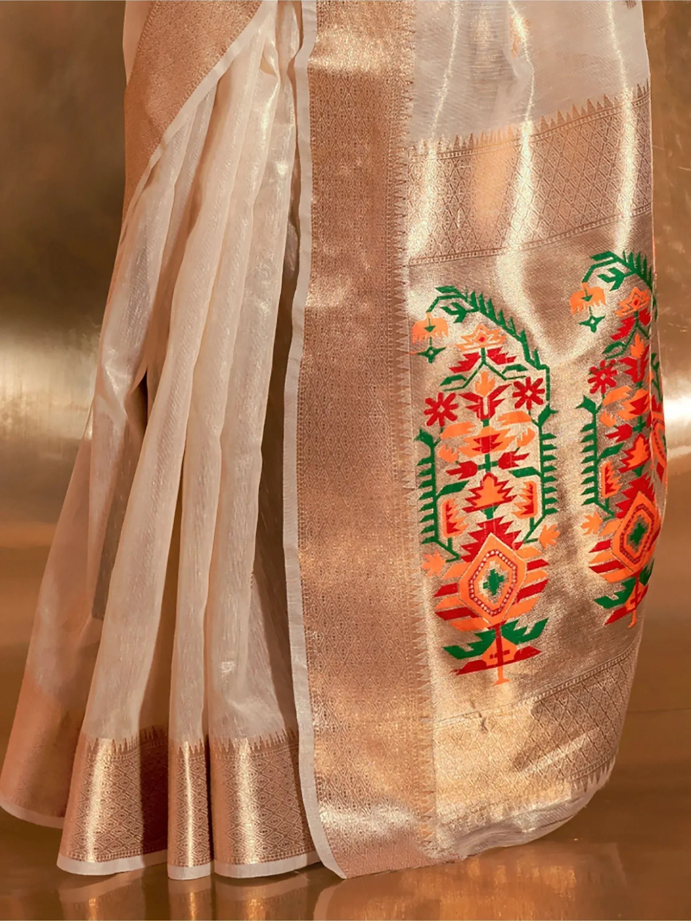 White saree with gold border and vibrant red, orange, green floral embroidery, Indian ethnic wear