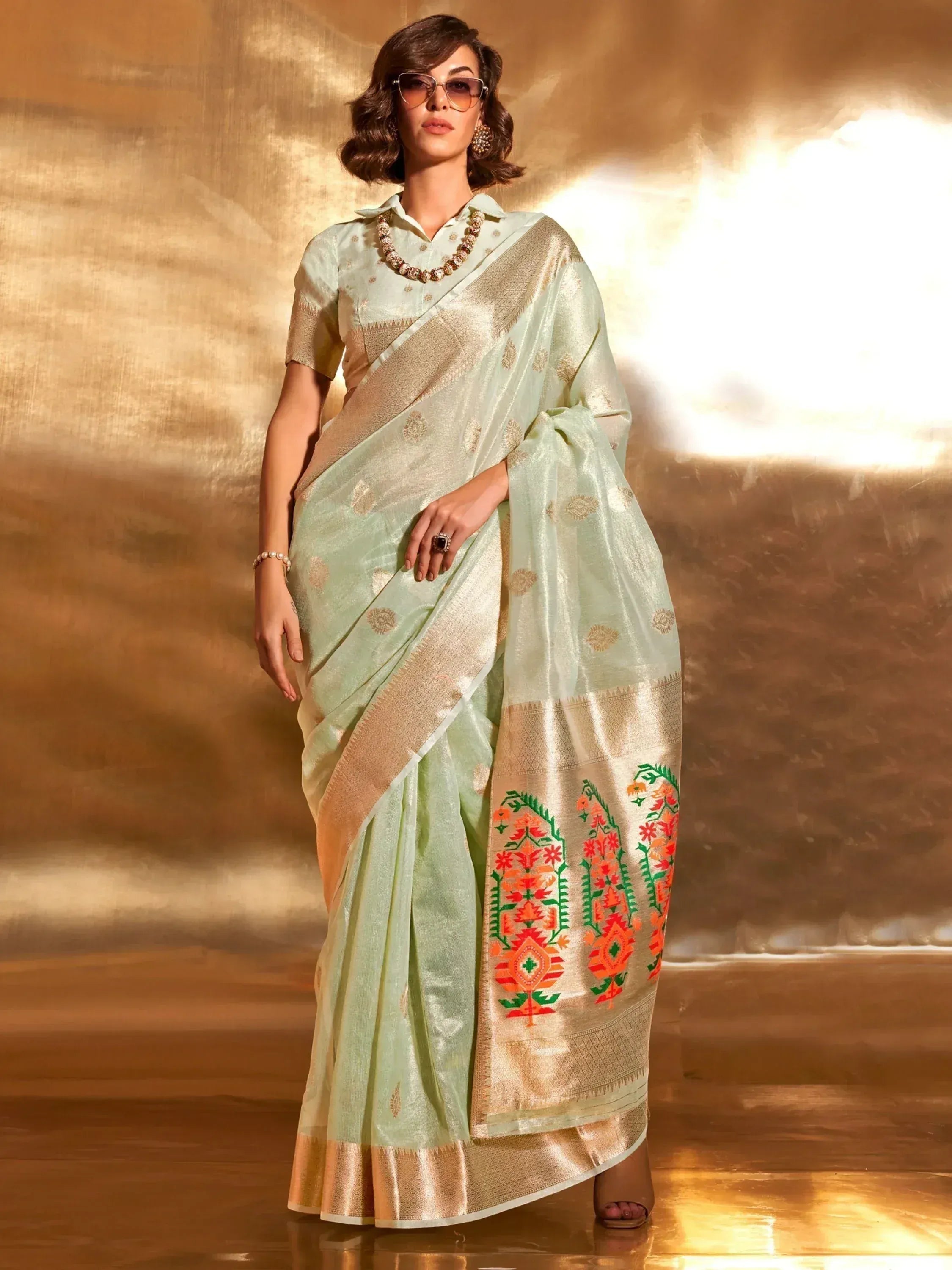 Mint green designer saree with gold zari and floral embroidery, perfect for ethnic occasions
