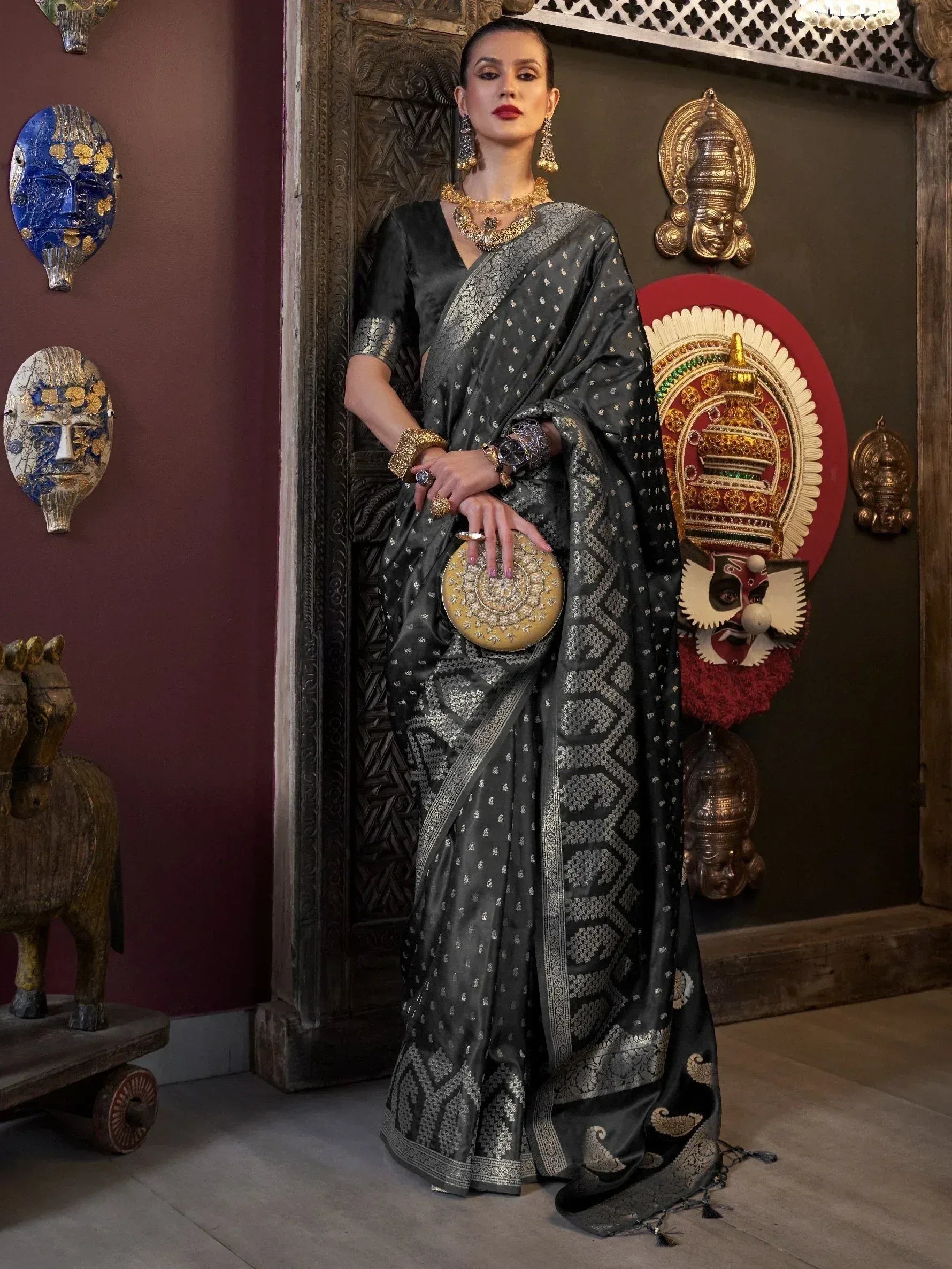 Elegant black and silver designer saree with intricate patterns, perfect for Indian ethnic wear occasions.