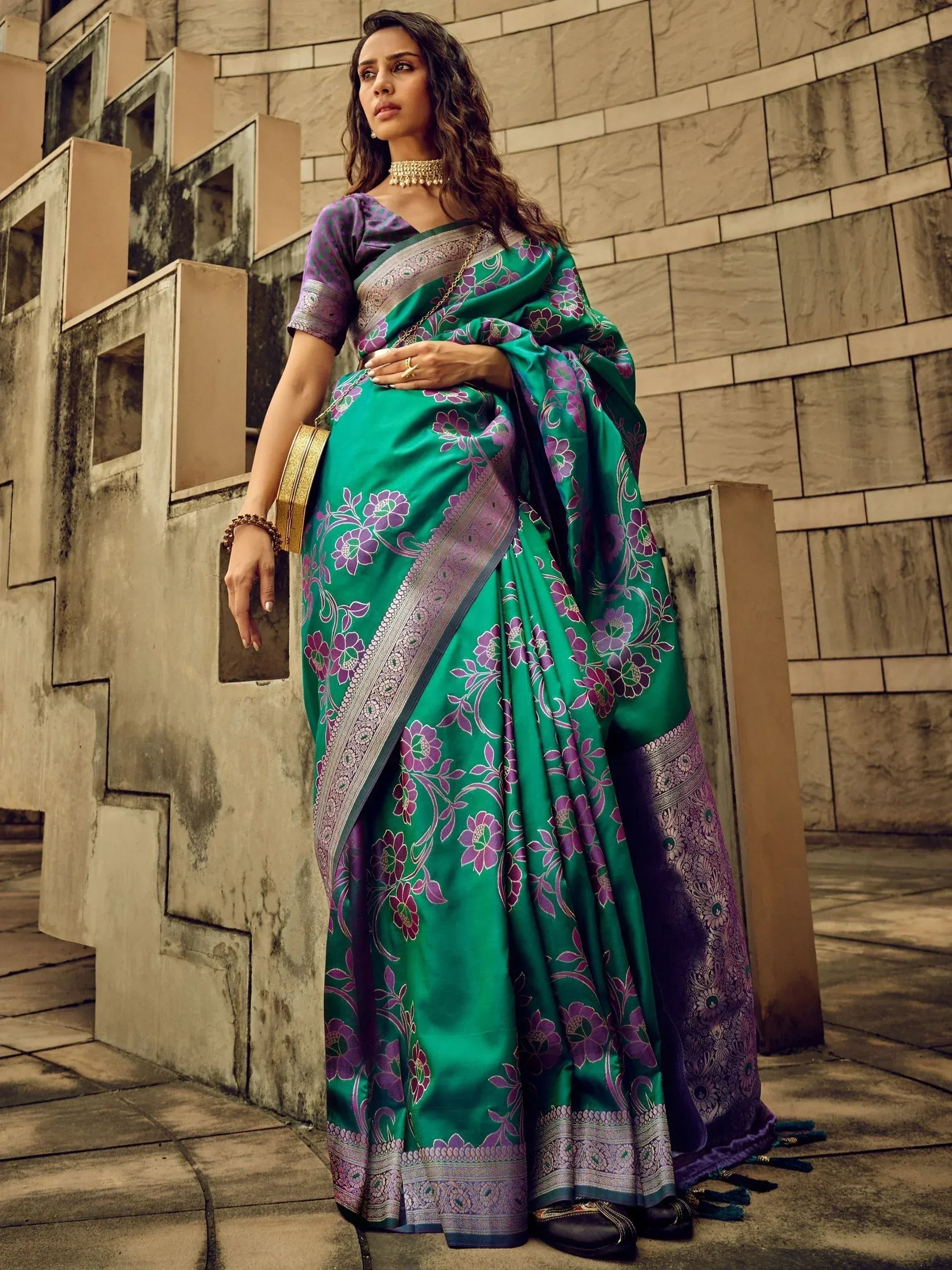 Emerald green saree with purple floral print and woven border, paired with matching blouse, perfect for Indian ethnic occasions.