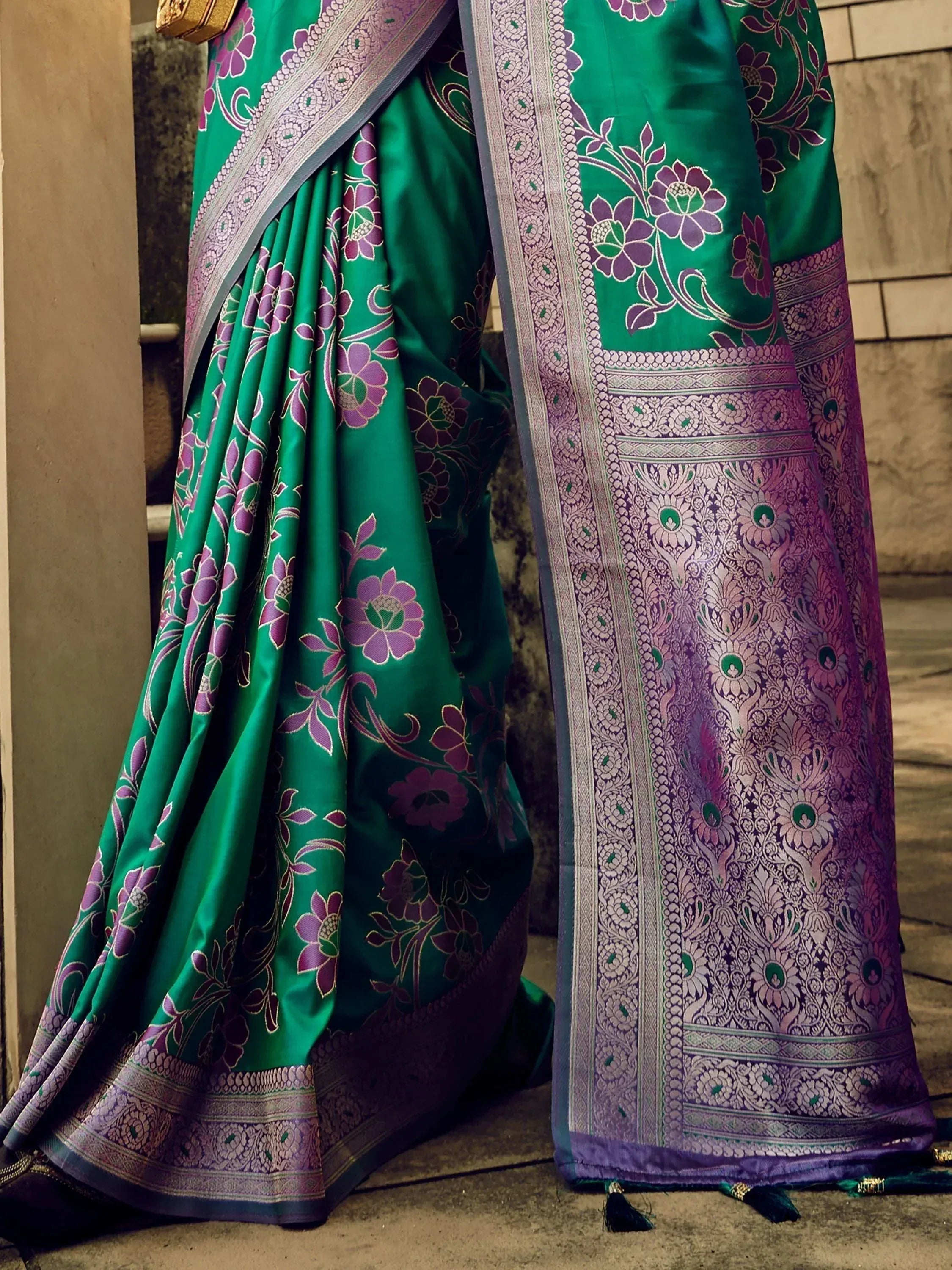 Emerald green saree with purple floral print and intricate border, ideal for Indian ethnic wear occasions.