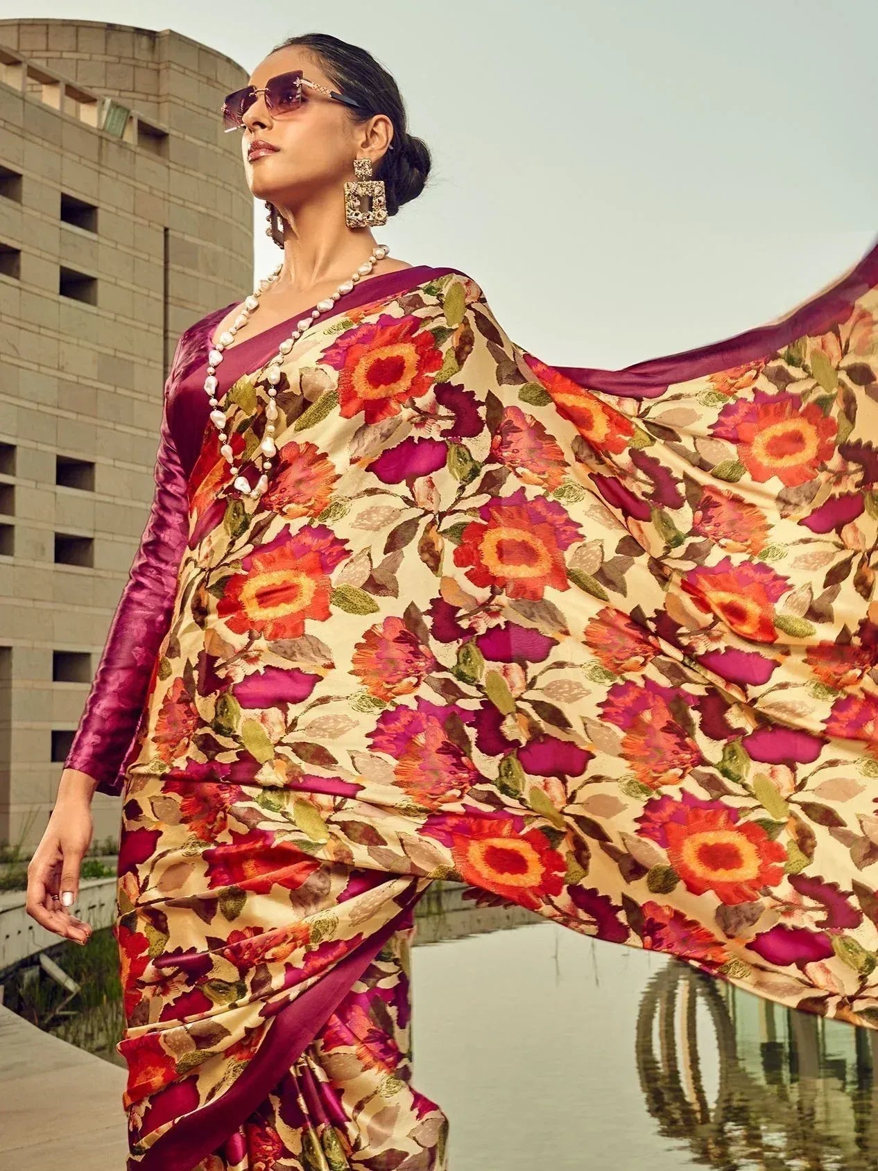 Woman in floral print saree with purple blouse, stylish ethnic wear for modern occasions