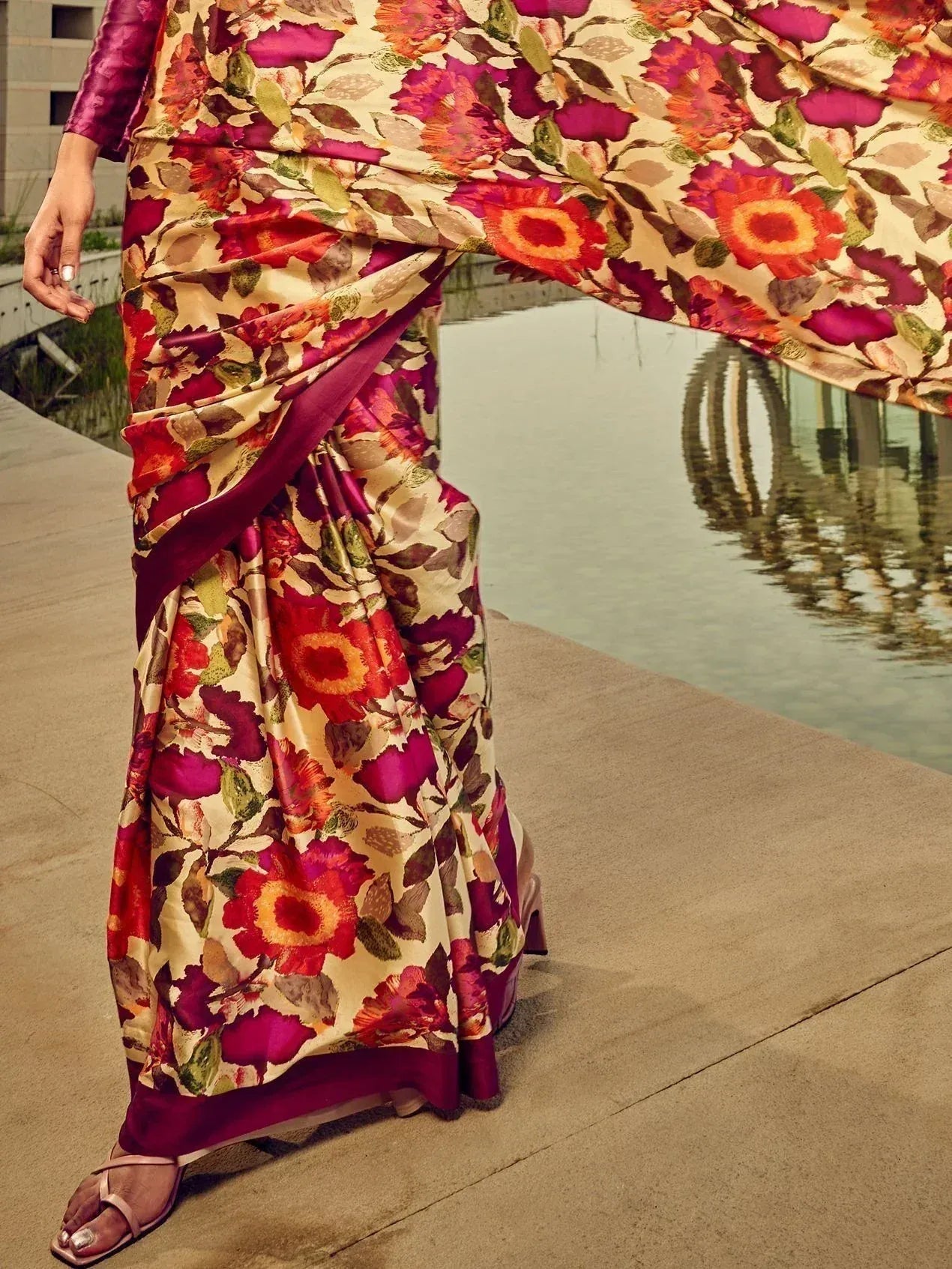 Floral print saree with vibrant red and purple hues, paired with matching blouse, ideal for ethnic occasions