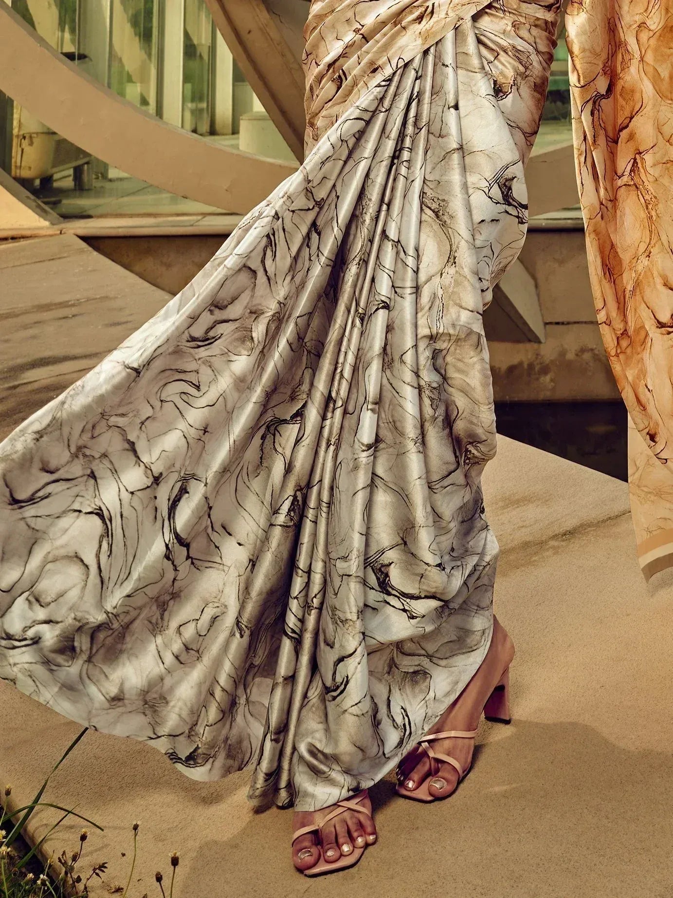 Elegant marble-print saree with flowing drape, styled with heels for Indian ethnic wear