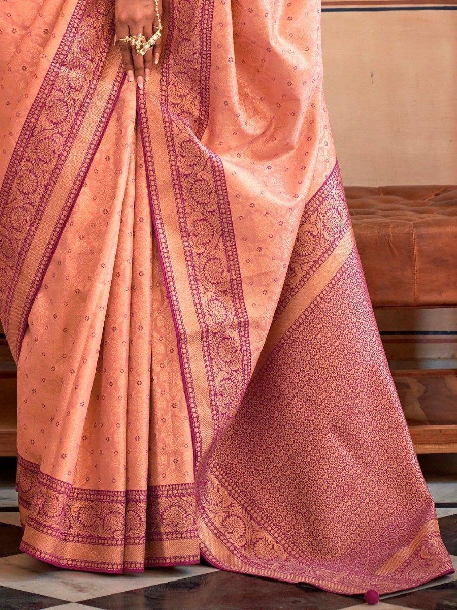 Peach and maroon designer saree with intricate floral border, perfect for Indian ethnic occasions