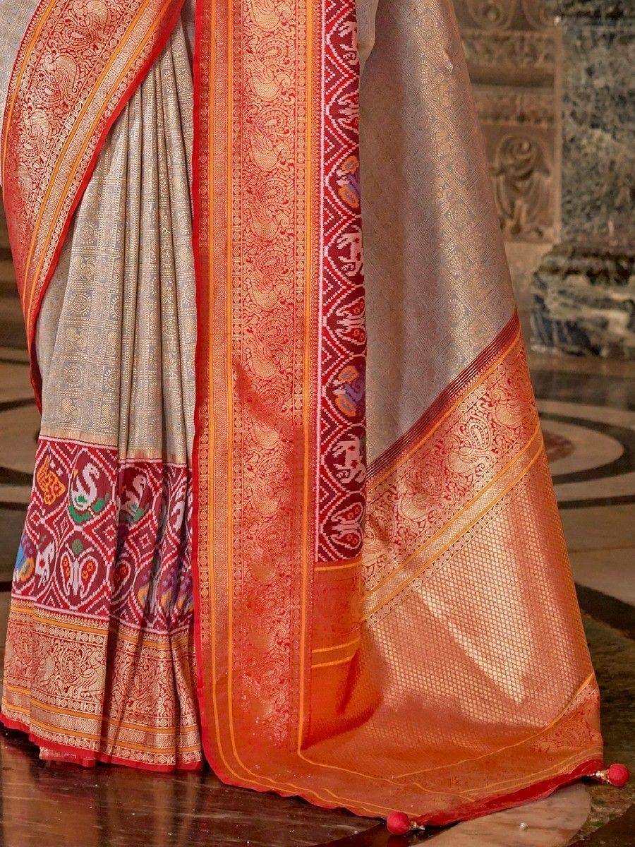 Elegant Indian saree with intricate red and gold border, perfect for ethnic occasions