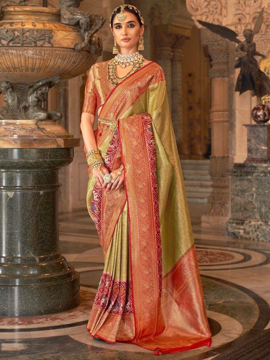 Elegant olive green and red designer saree with intricate embroidery, perfect for ethnic occasions