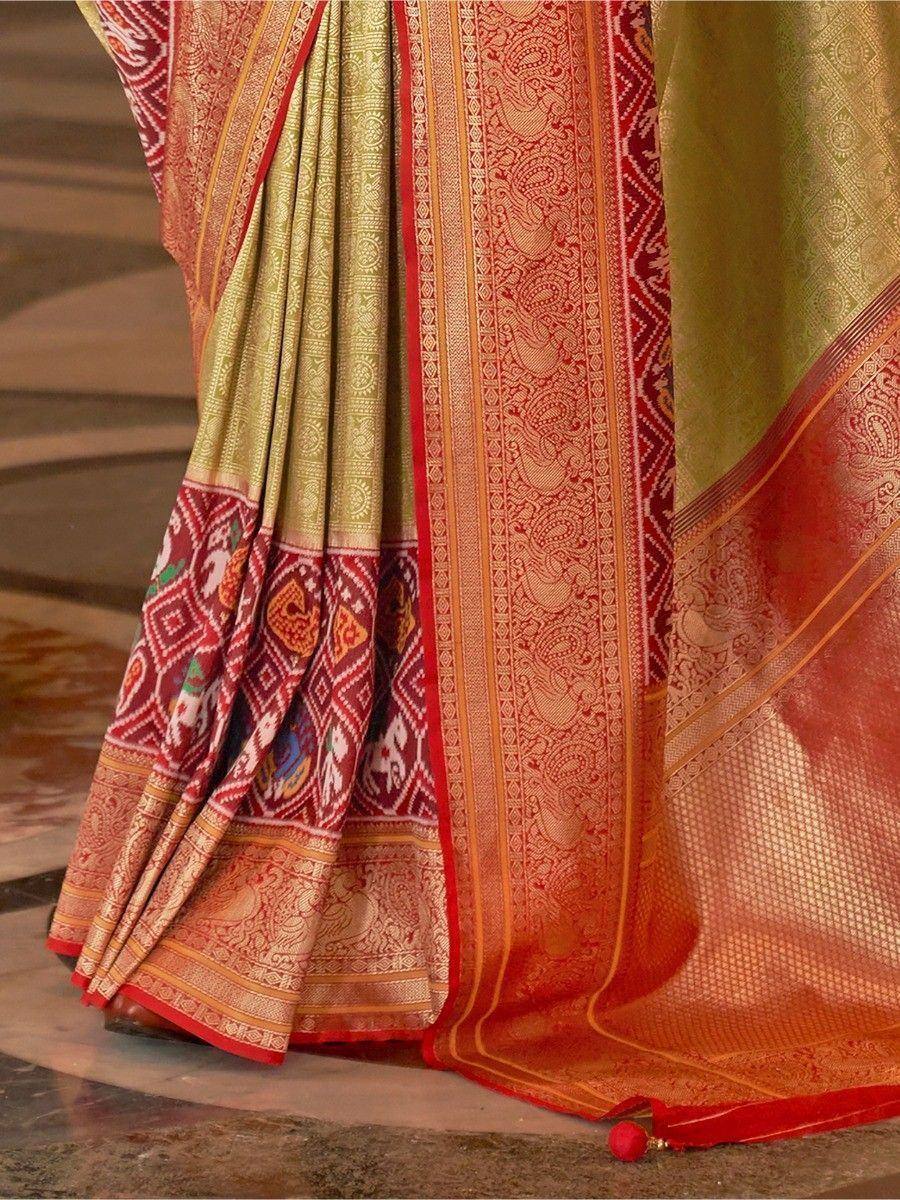Elegant Indian saree with intricate red and gold patterns, perfect for festive occasions