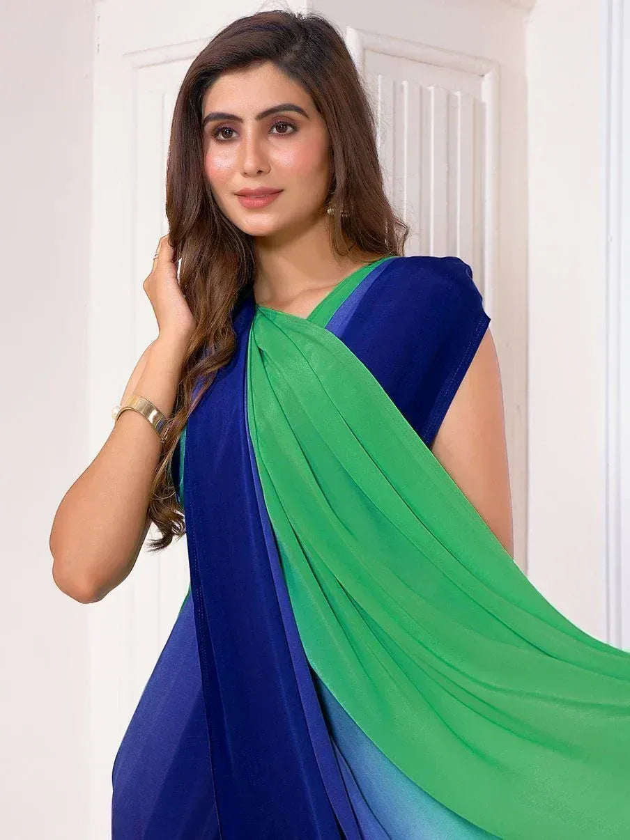 Woman in blue and green ethnic saree with pleated drape, stylish Indian wear