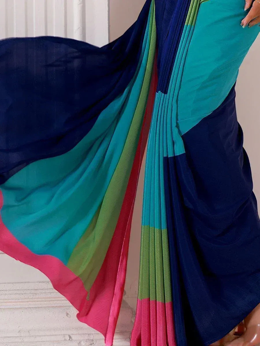 Vibrant multicolor saree with navy, teal, green, and pink panels, styled for ethnic wear
