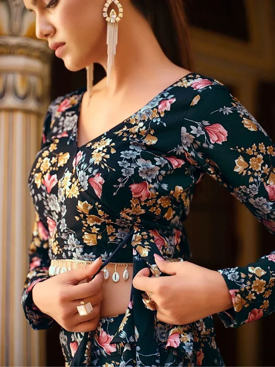 Floral print ethnic gown with V-neck and tie waist, paired with statement earrings and shell belt