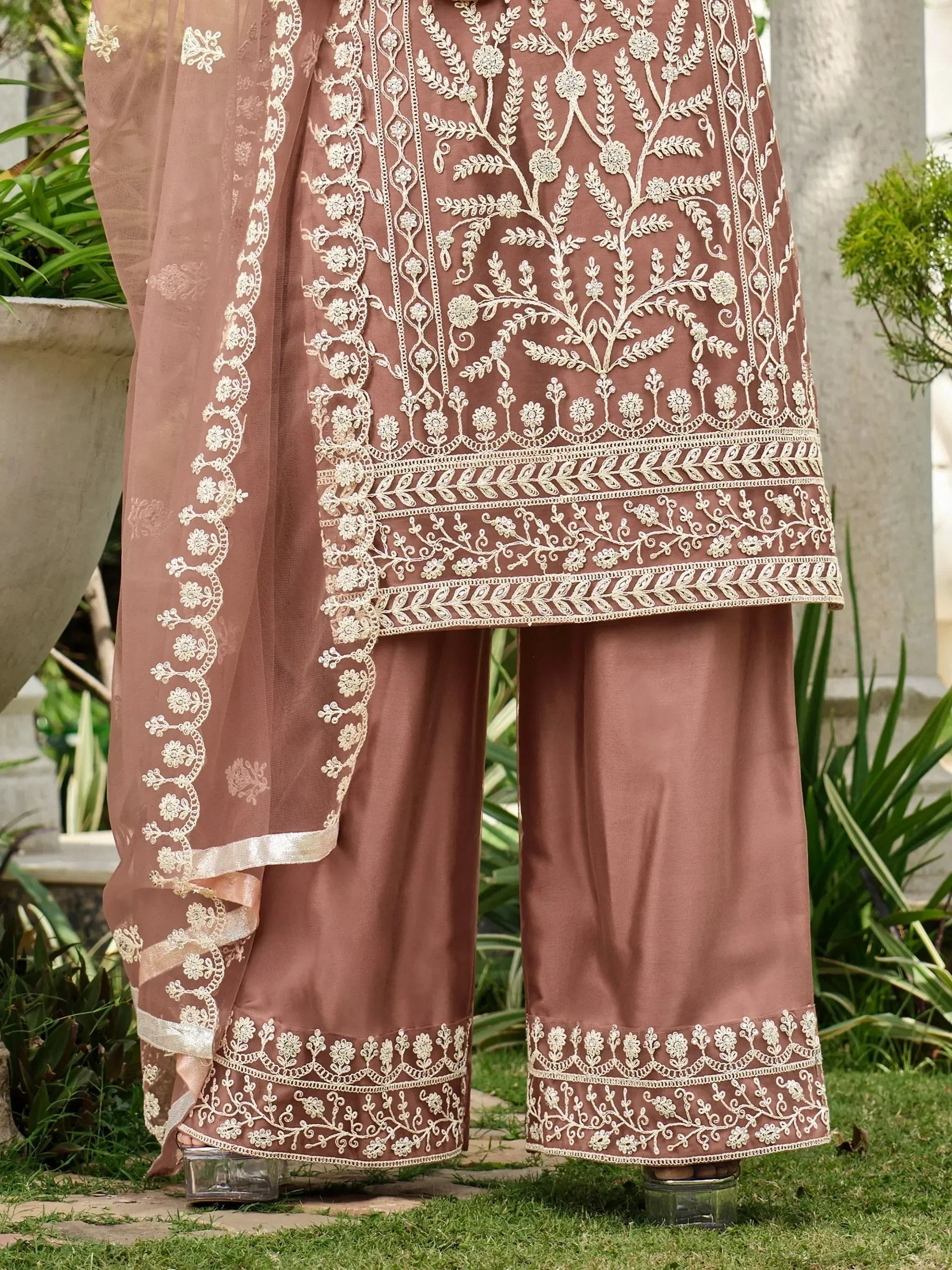 Elegant brown salwar kameez with intricate white floral embroidery, perfect for ethnic occasions.