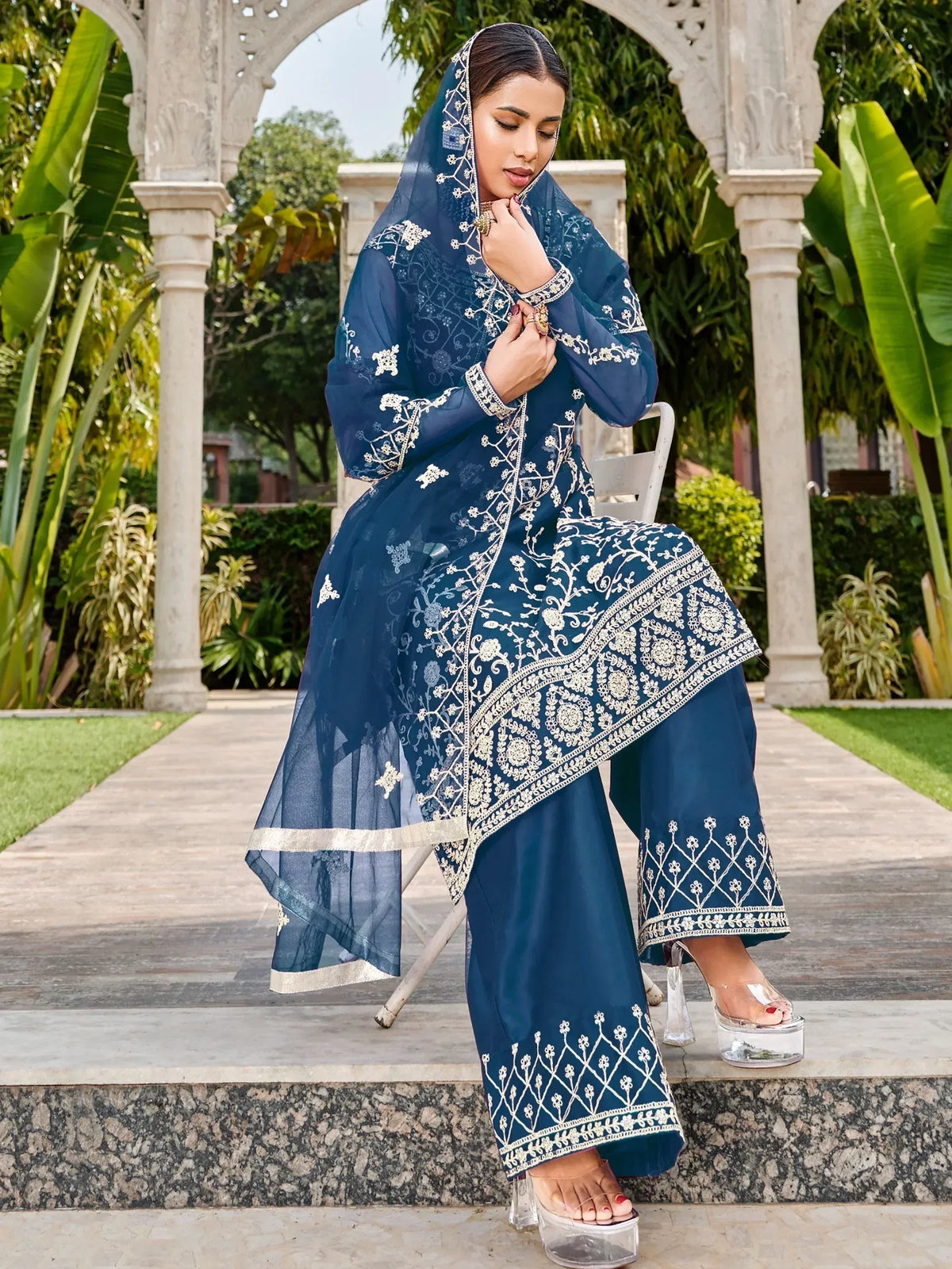 Navy blue embroidered salwar kameez with dupatta, ethnic wear for women, floral detailing, garden setting