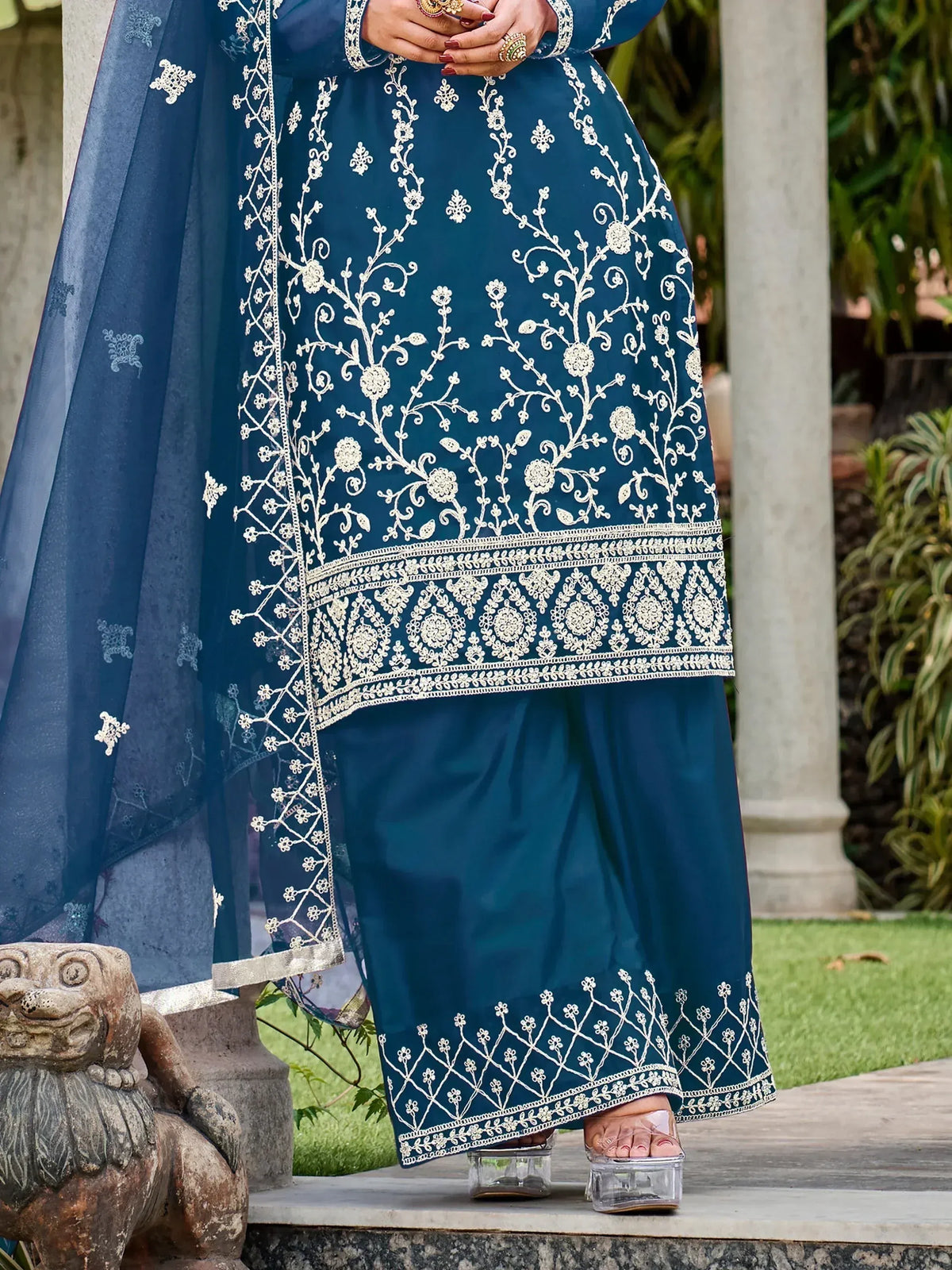 Teal blue embroidered salwar kameez with white floral work, perfect for Indian ethnic wear occasions
