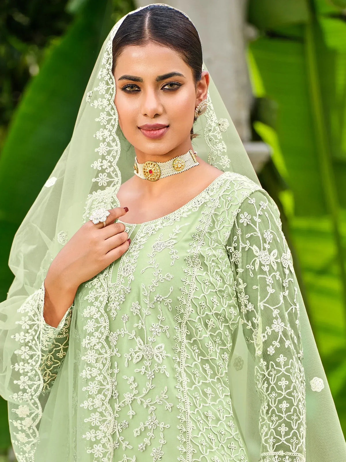 Mint green embroidered ethnic gown with matching dupatta, perfect for Indian weddings and festive occasions.