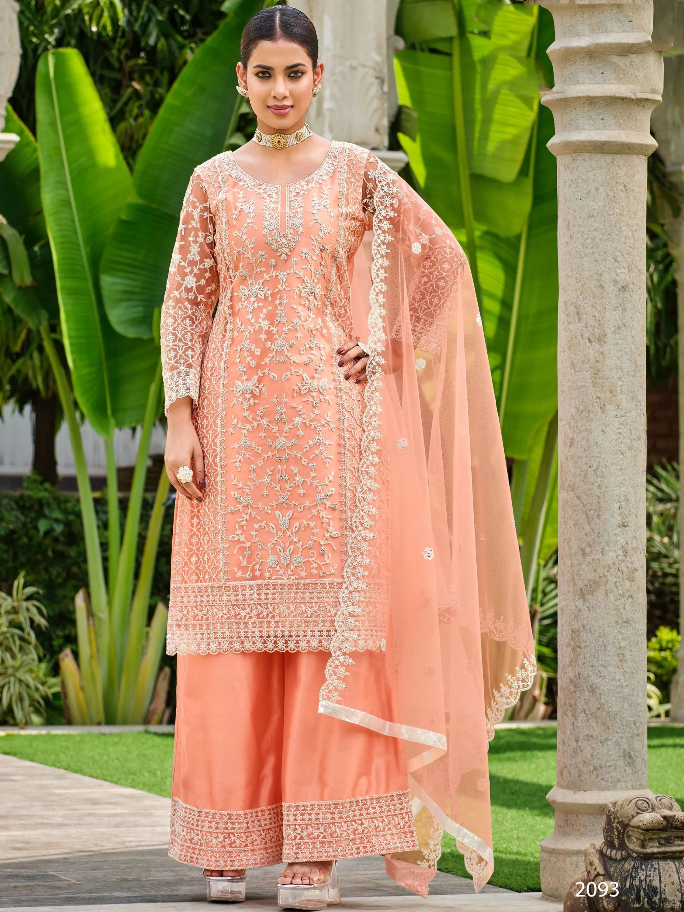 Peach embroidered palazzo salwar suit with net dupatta, Indian ethnic wear, outdoor setting
