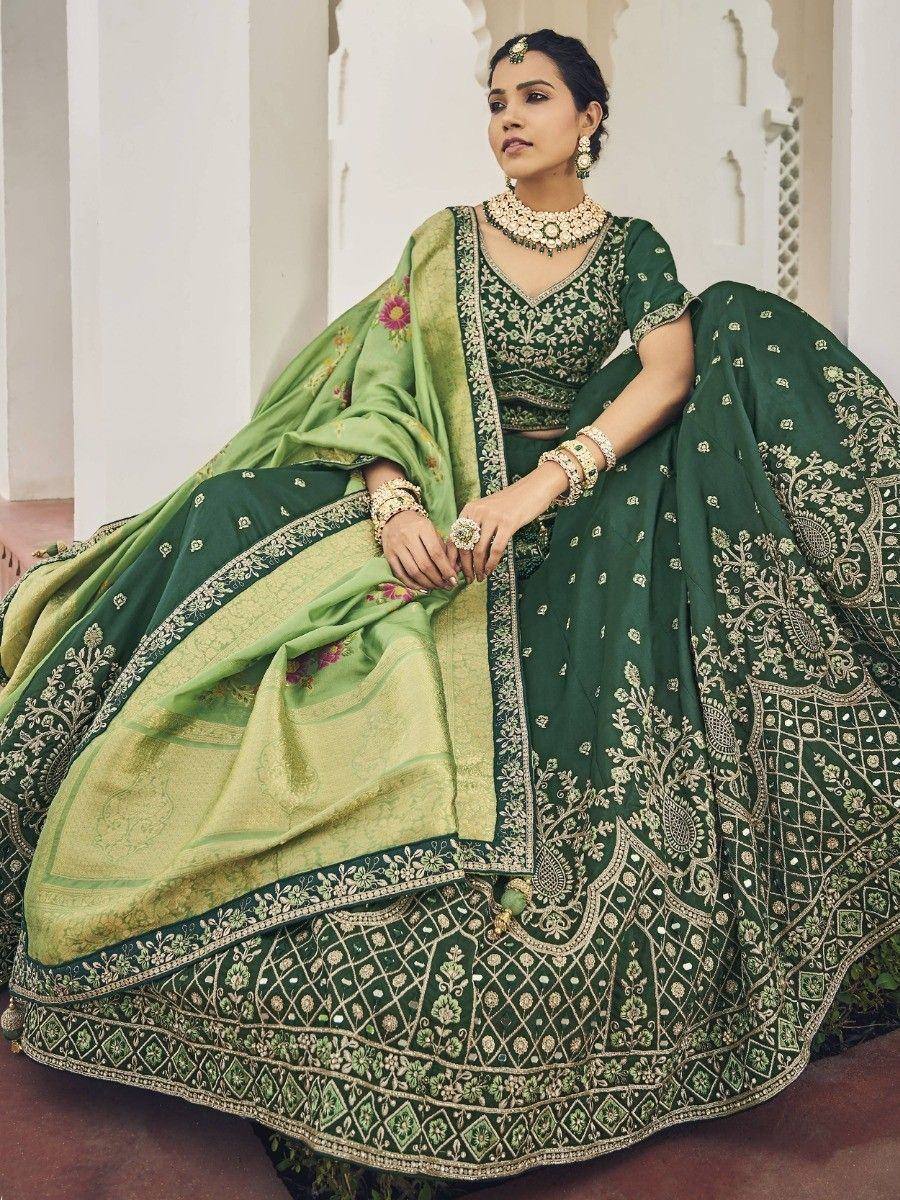 Elegant green embroidered lehenga choli with floral dupatta, perfect for Indian weddings and festive occasions.