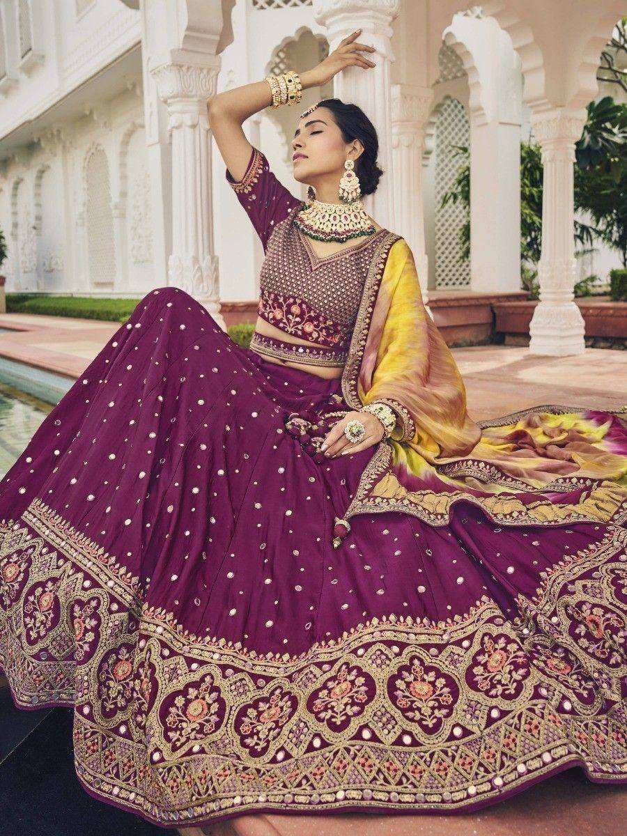 Elegant purple lehenga choli with gold embroidery, perfect for Indian weddings and festive occasions.
