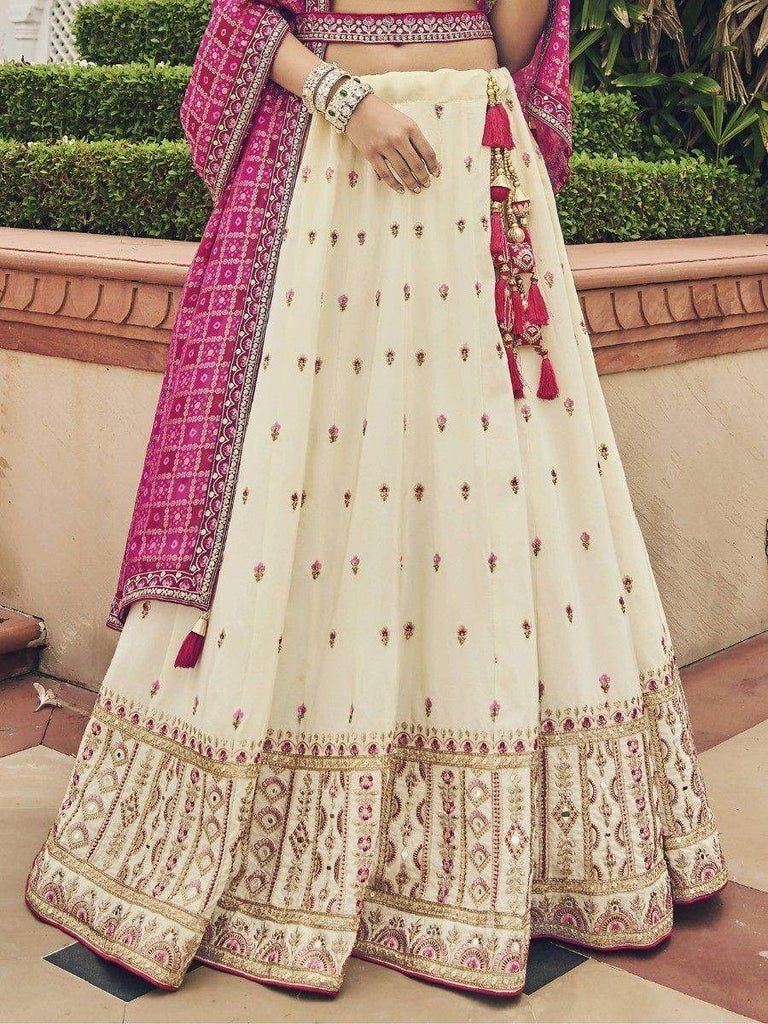 Enchanting Off-White Embroidered Silk Wedding Wear Lehenga Choli