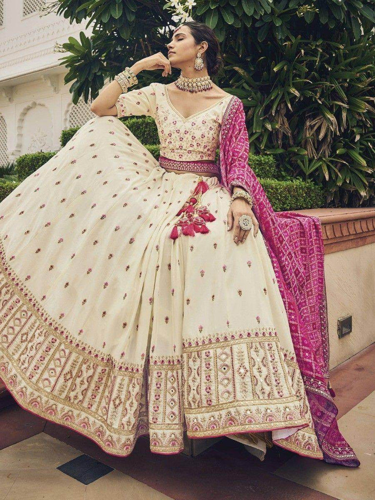 Enchanting Off-White Embroidered Silk Wedding Wear Lehenga Choli