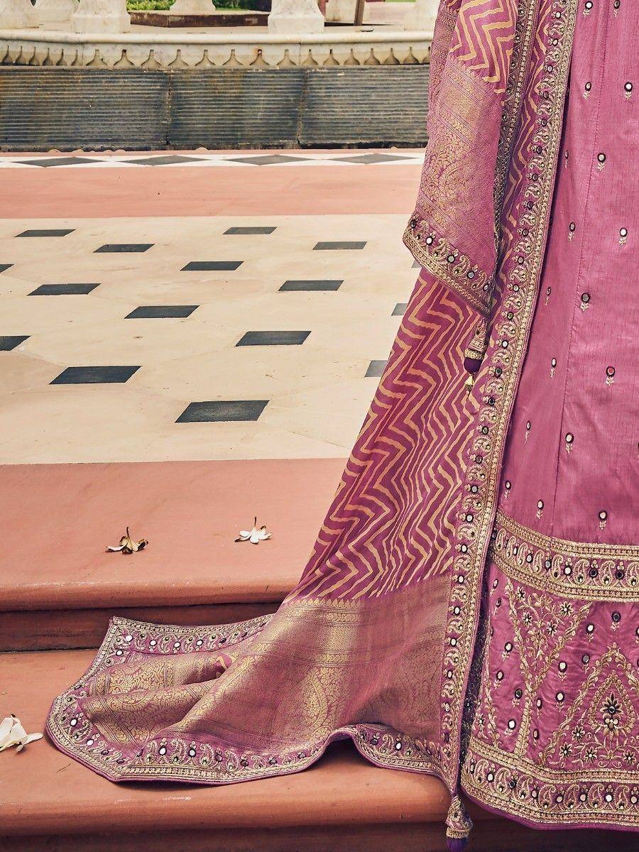 Pink ethnic lehenga choli with gold zari work and mirror detailing, perfect for Indian weddings and festivals