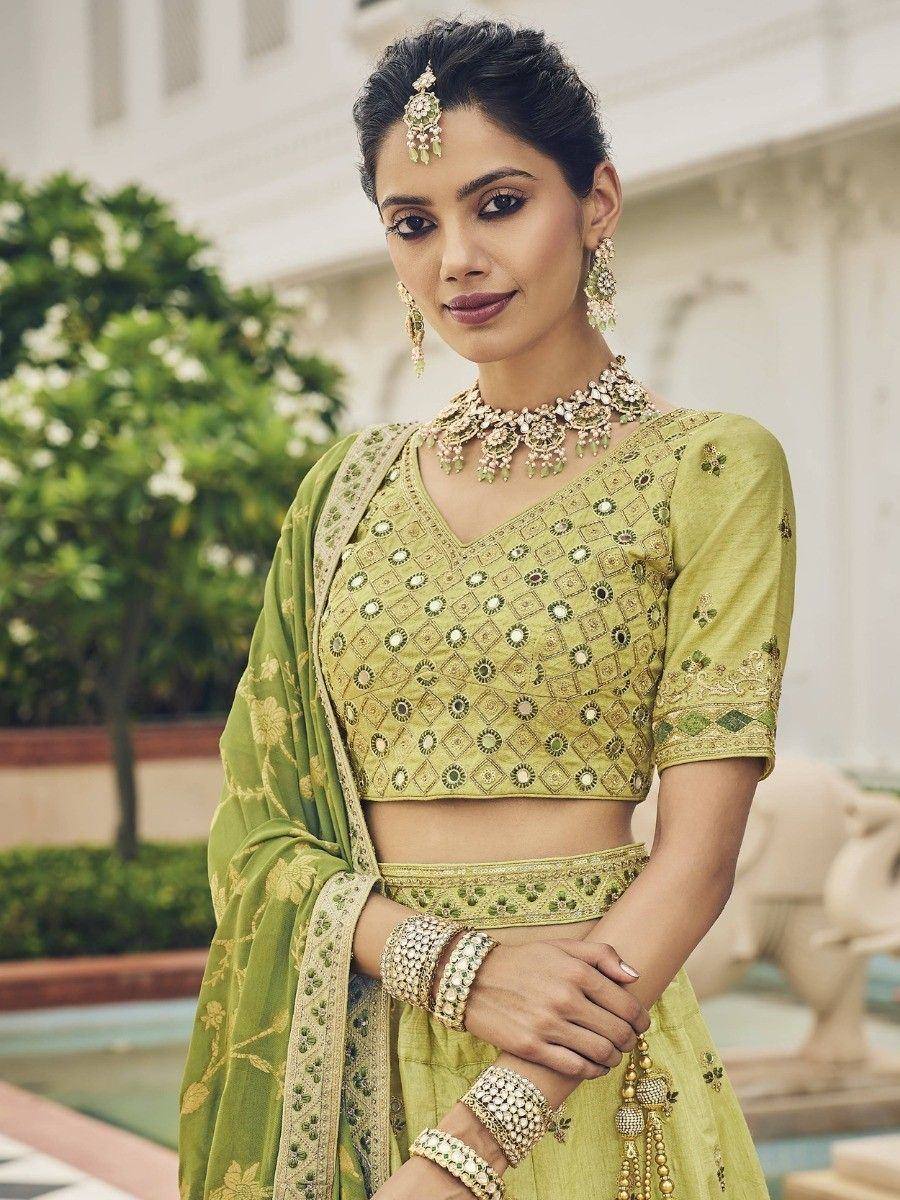 Elegant green lehenga choli with intricate embroidery, perfect for Indian ethnic wear and festive occasions.