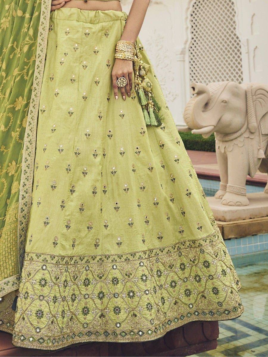 Light green embroidered lehenga with gold detailing, perfect for Indian ethnic wear and festive occasions.