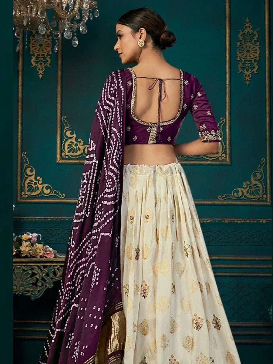 Purple and cream designer lehenga choli with backless blouse and embroidered dupatta