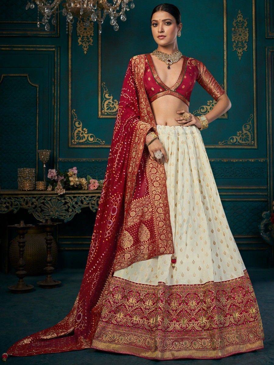 Red and cream designer lehenga choli with gold embroidery, perfect for Indian weddings and festive occasions