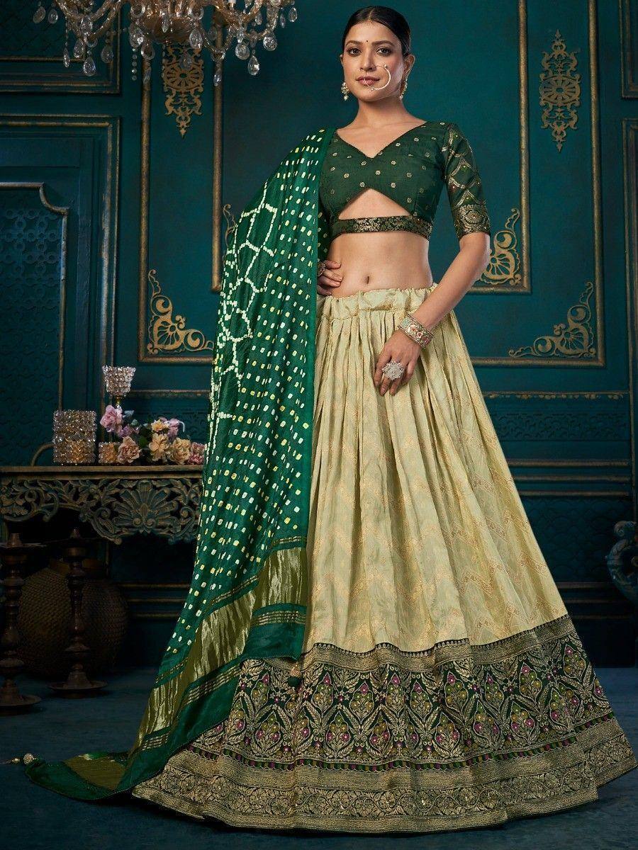 Green and gold designer lehenga choli with embroidered skirt and dupatta, perfect for Indian ethnic wear
