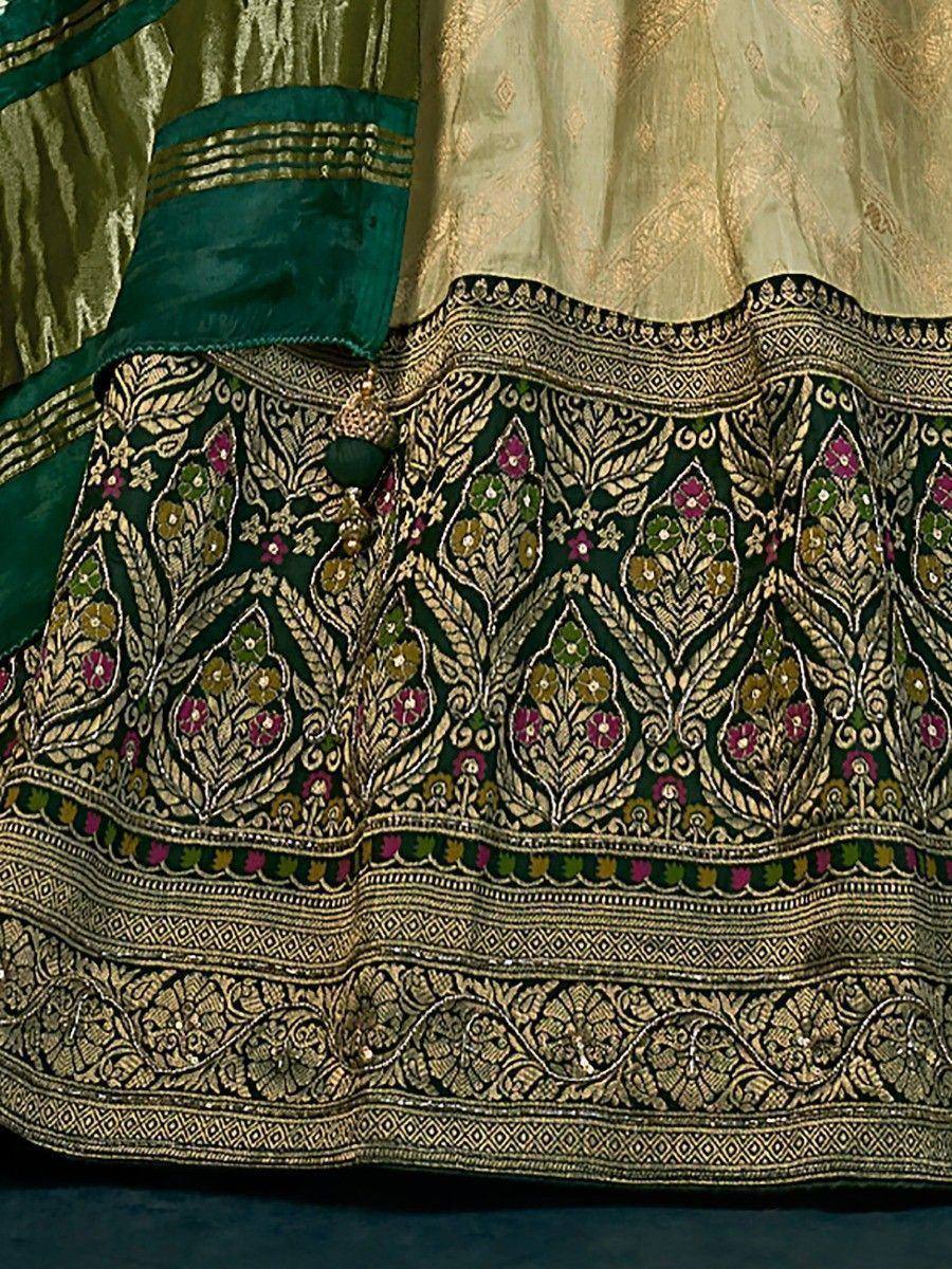 Designer lehenga choli with intricate gold and floral embroidery, ethnic Indian wear