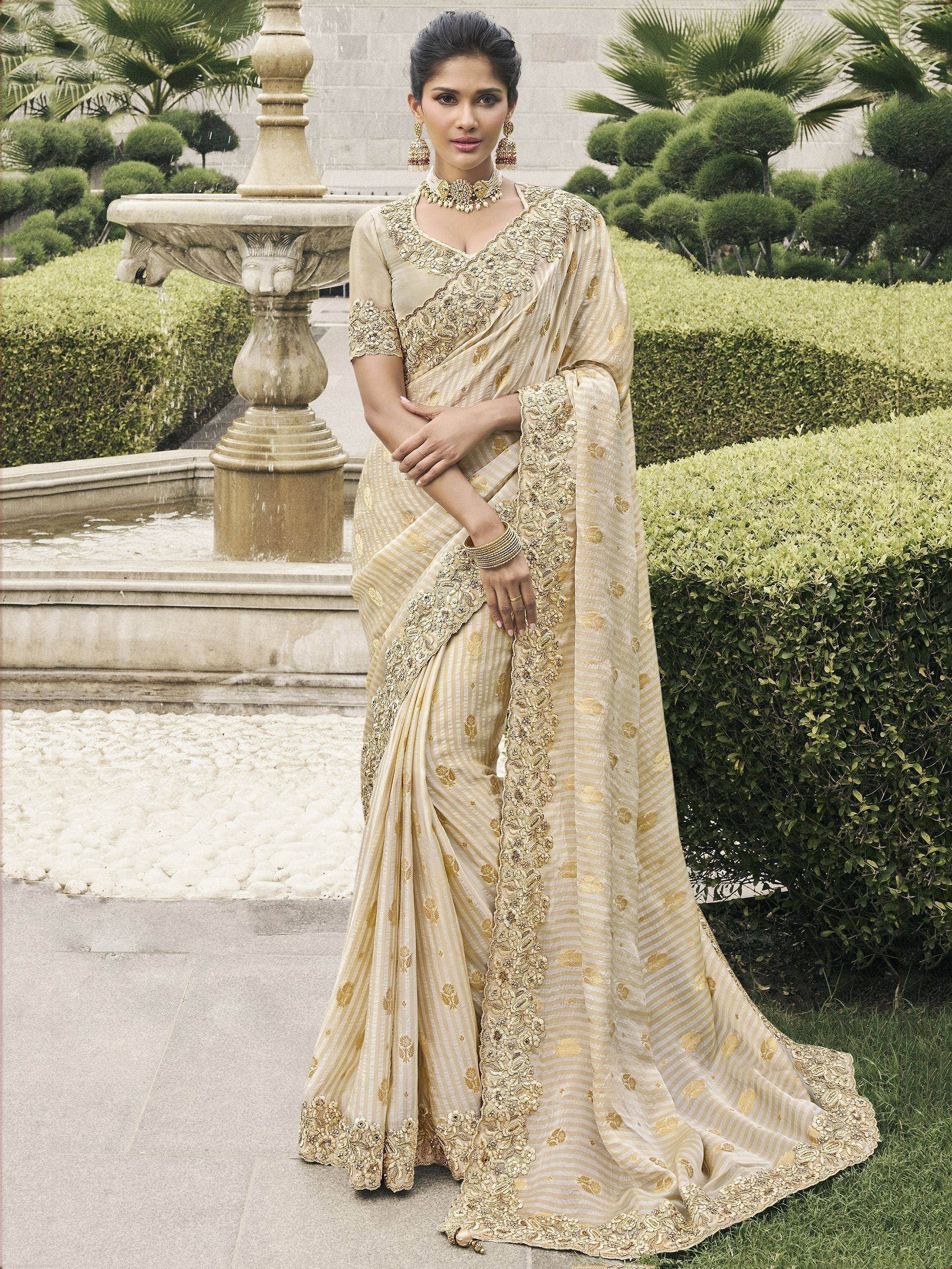 Elegant beige saree with gold embroidery, perfect for Indian ethnic wear occasions