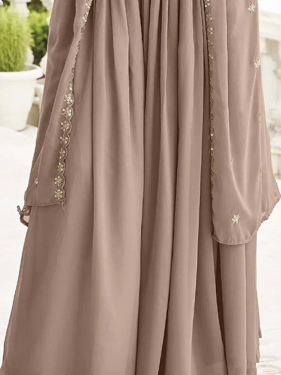 Elegant beige ethnic gown with floral embroidery and sequin detailing, perfect for Indian occasions
