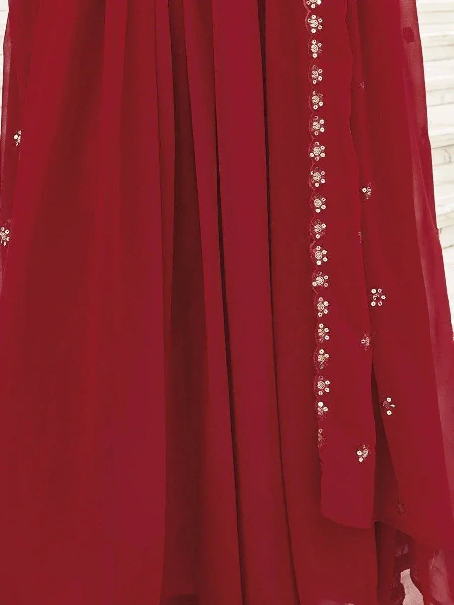 Red ethnic gown with floral sequin embroidery, perfect for Indian weddings and festive occasions.