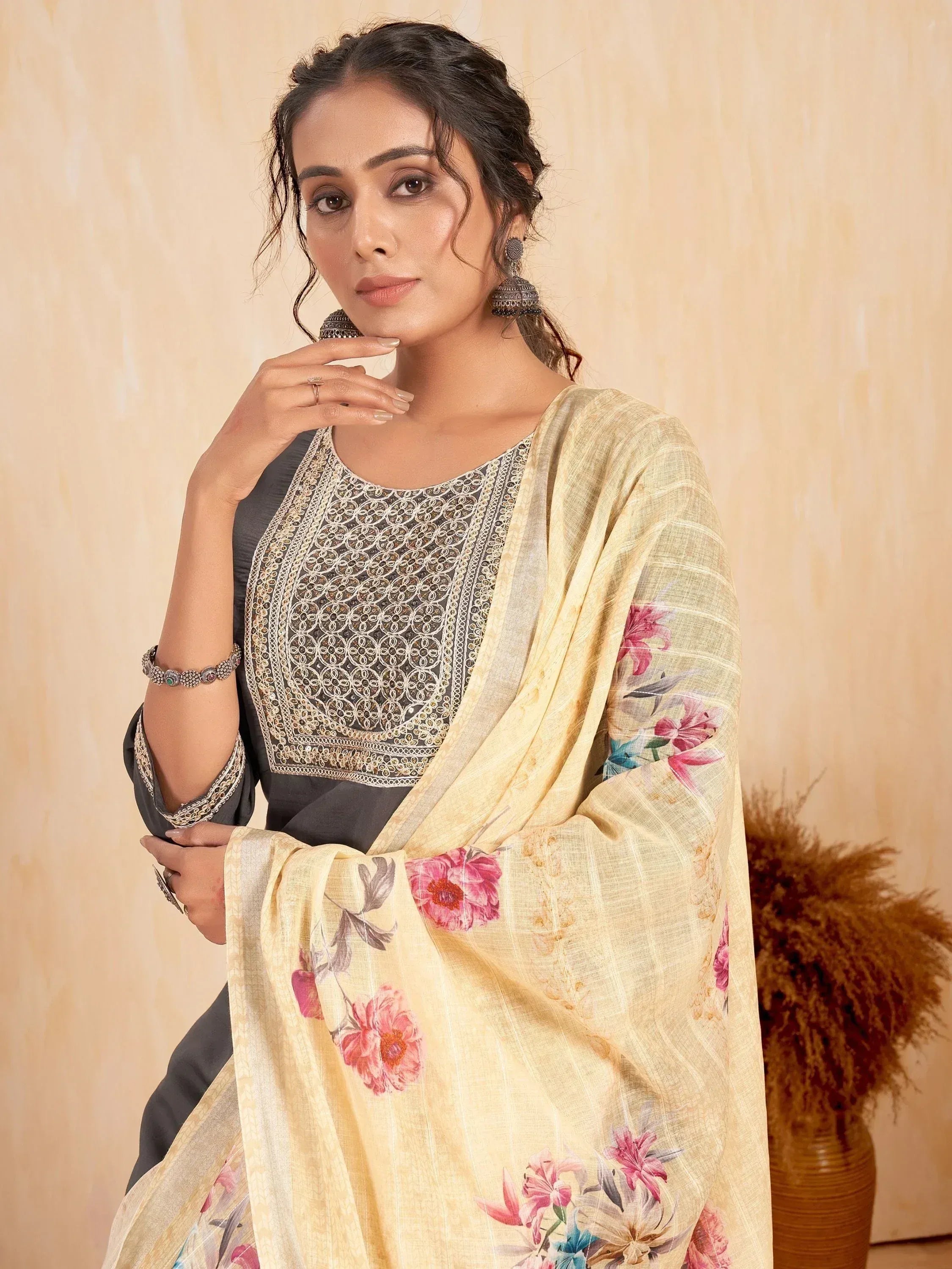 Woman in grey embroidered kurta with floral yellow dupatta, Indian ethnic wear