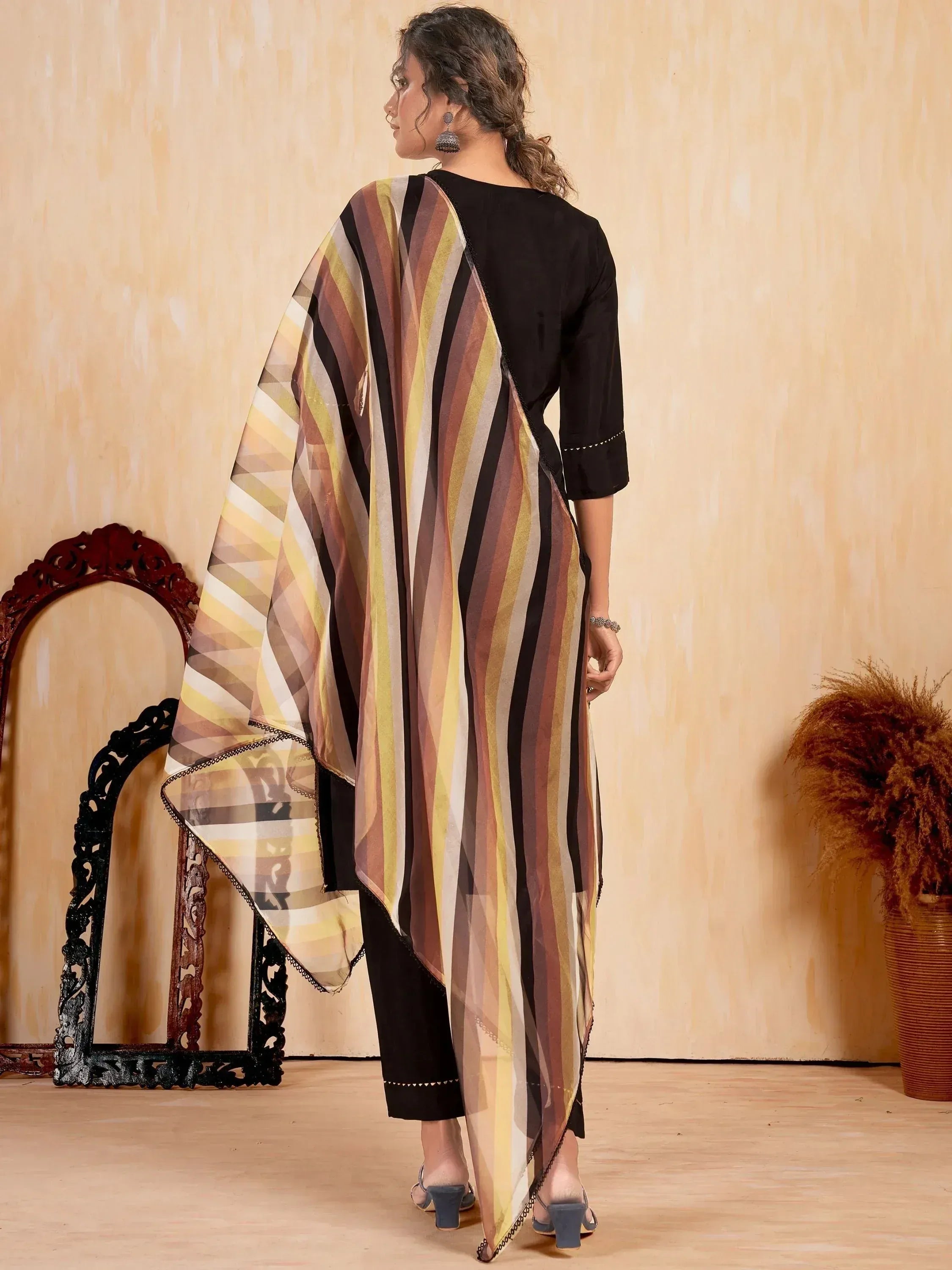 Woman in black kurta with striped dupatta, ethnic wear outfit, stylish Indian fashion