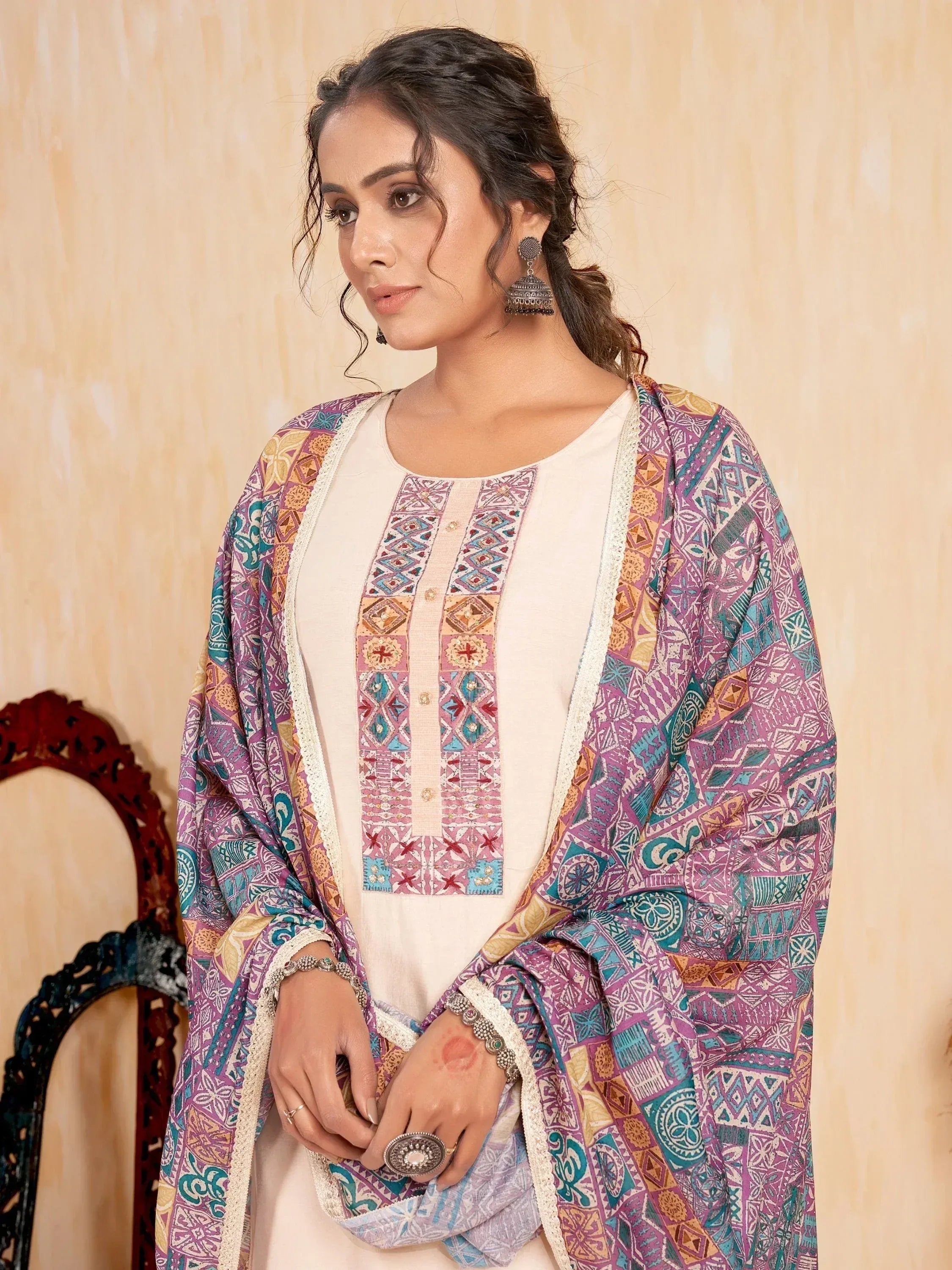 Woman in embroidered ethnic kurta with colorful printed dupatta, traditional Indian wear