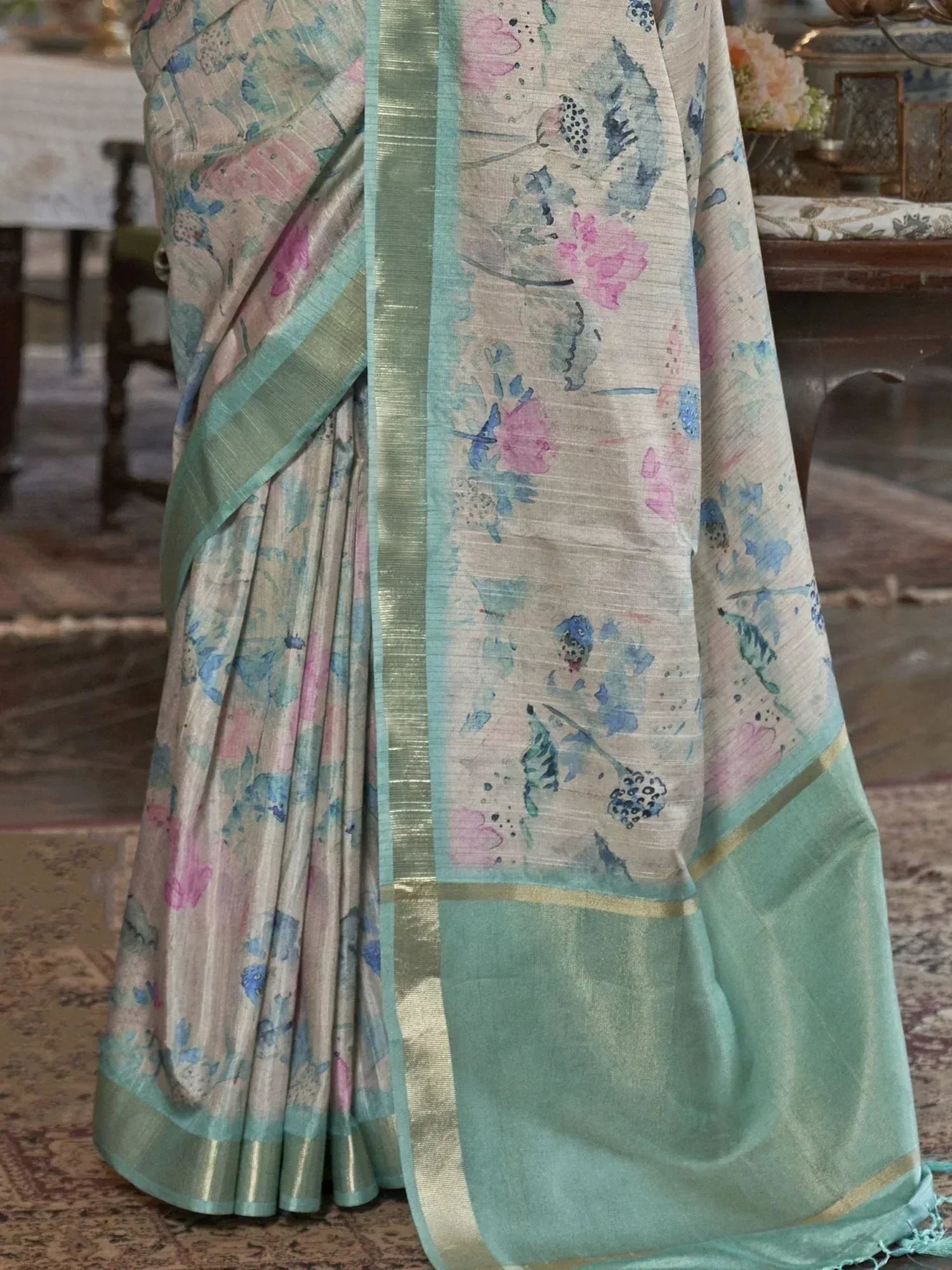 Floral print saree with mint green border, perfect for ethnic wear occasions