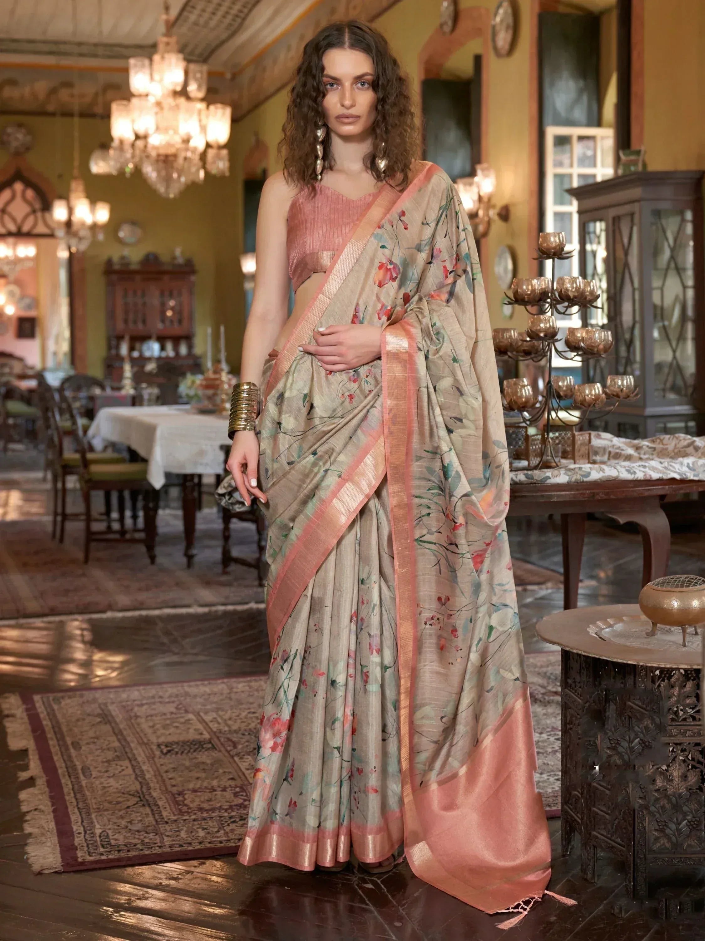Floral print saree with peach border, paired with matching blouse, elegant Indian ethnic wear