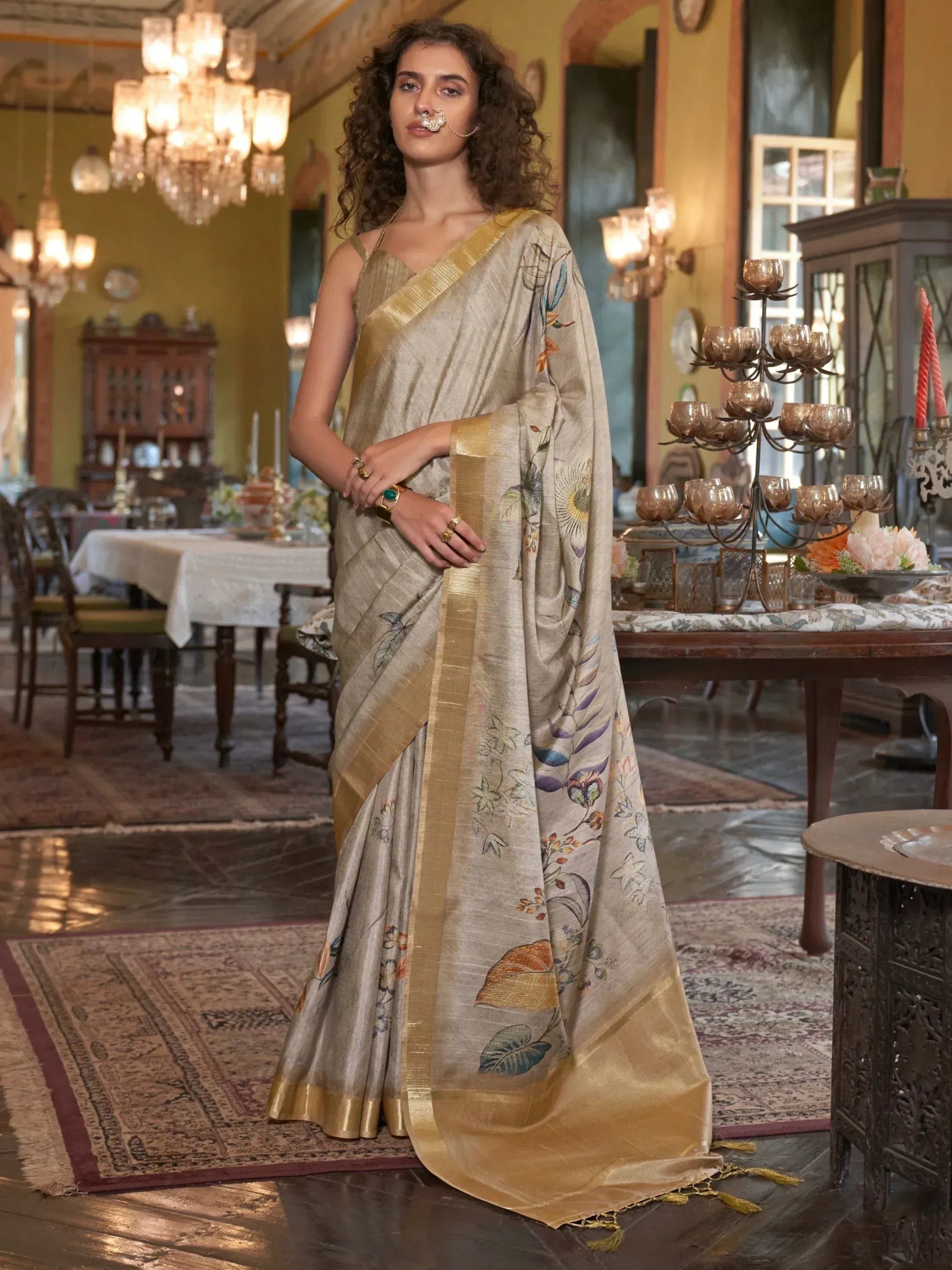 Elegant beige saree with floral print and gold border, perfect for Indian ethnic occasions