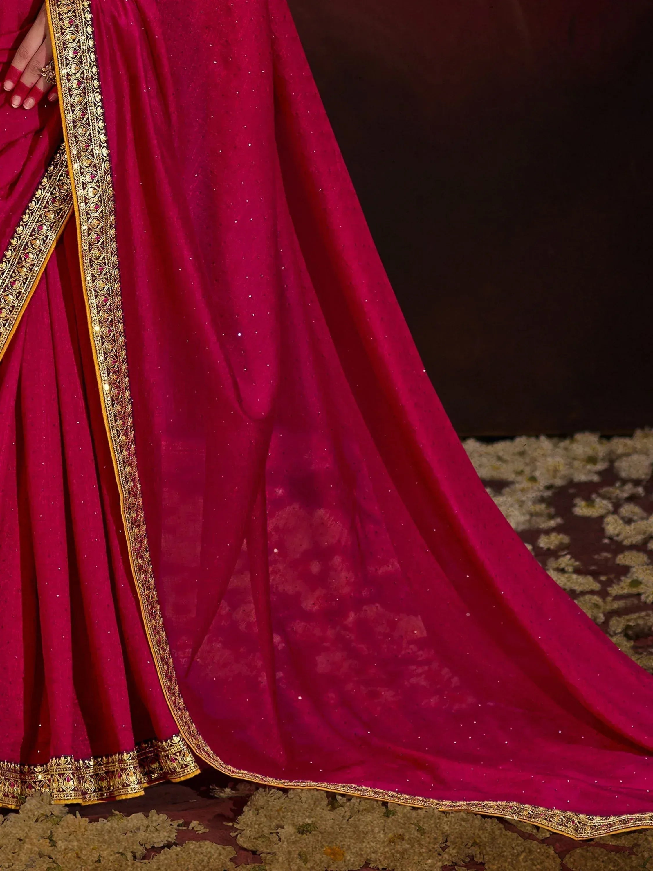 Rich magenta lehenga choli with gold embroidery and sequin detailing, perfect for Indian weddings and festive occasions.
