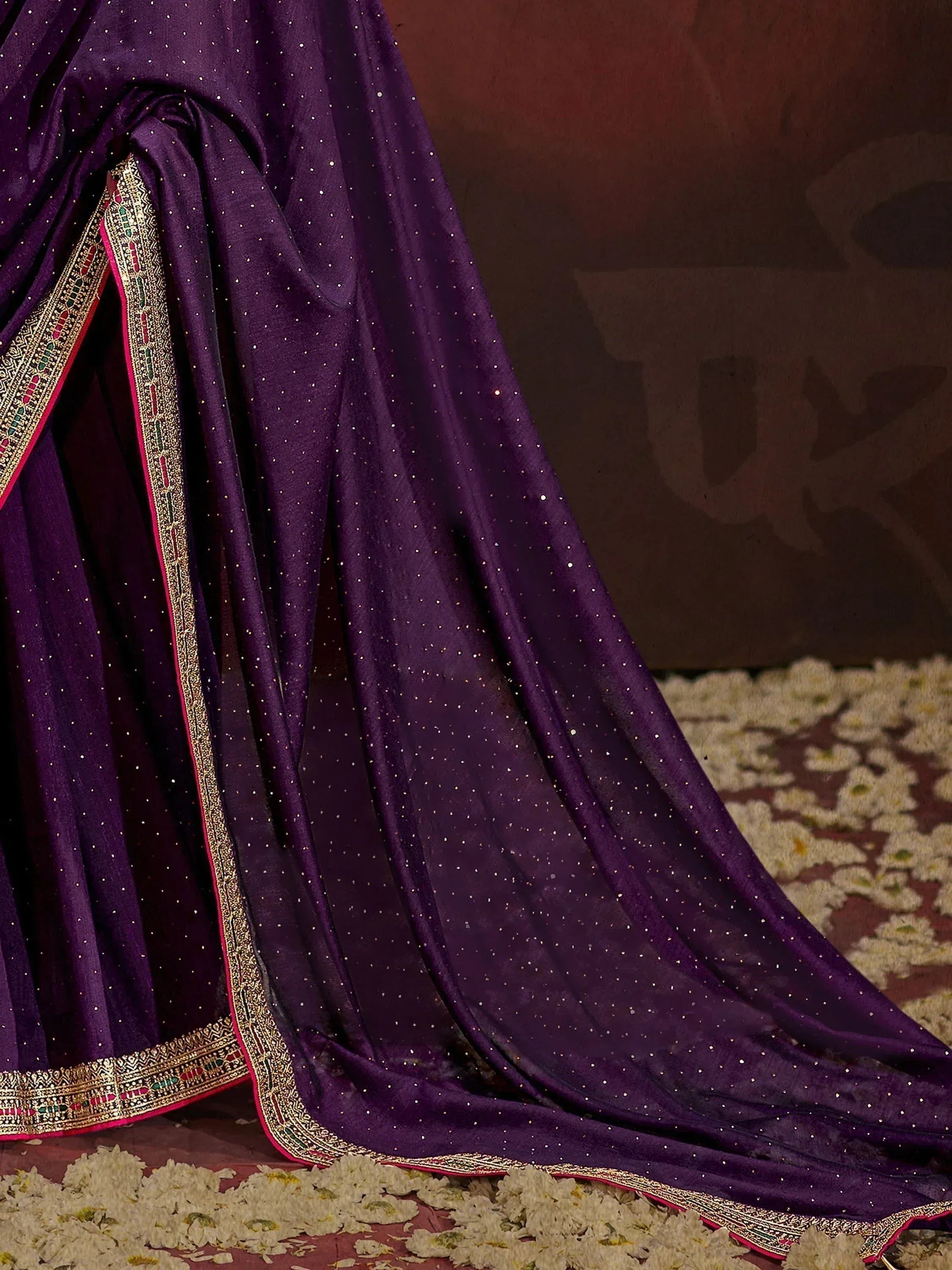 Purple ethnic saree with gold border and sequin detailing, perfect for Indian occasions