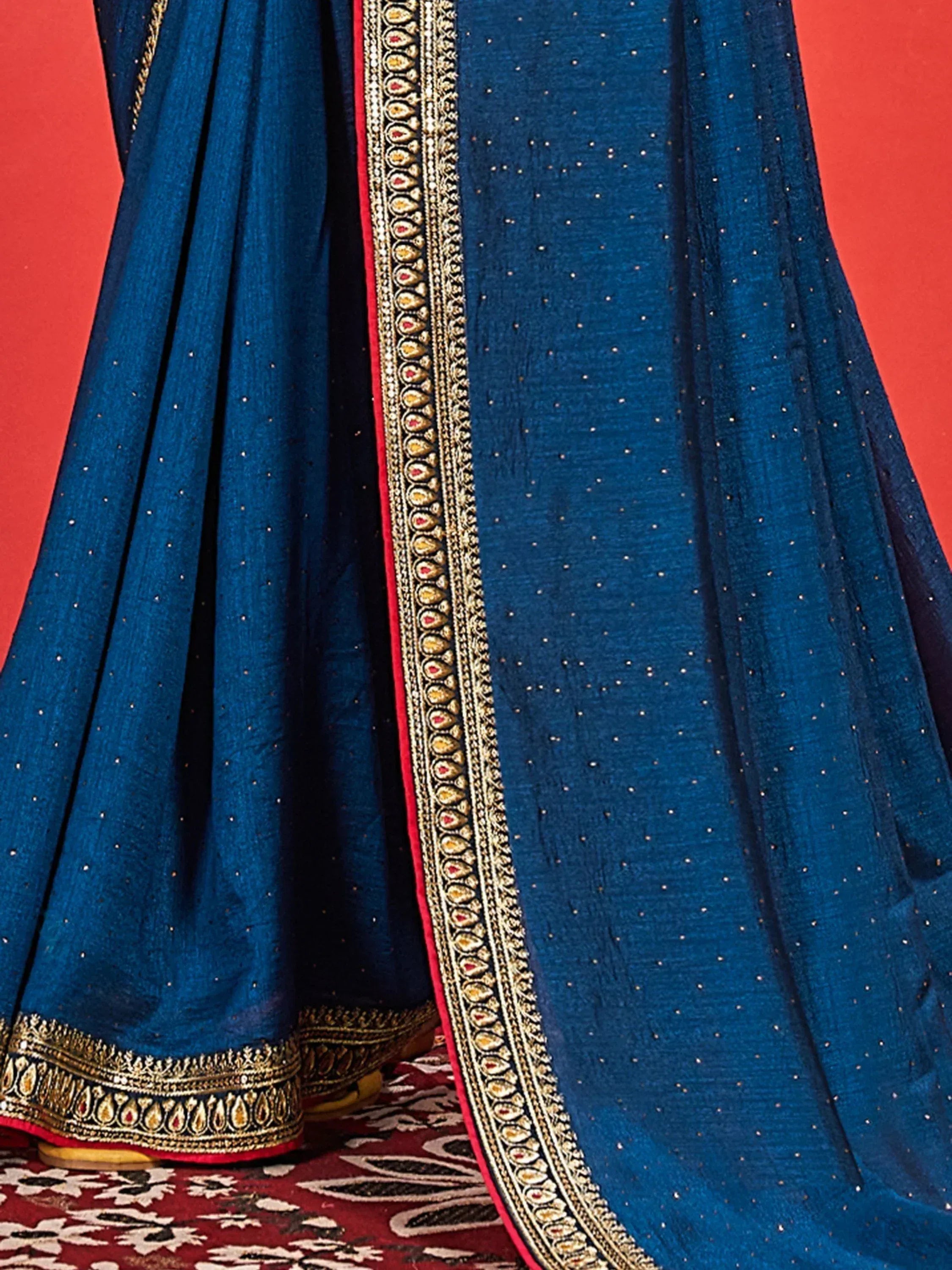Blue ethnic lehenga with gold embroidery and sequin detailing, perfect for Indian weddings and festivals.